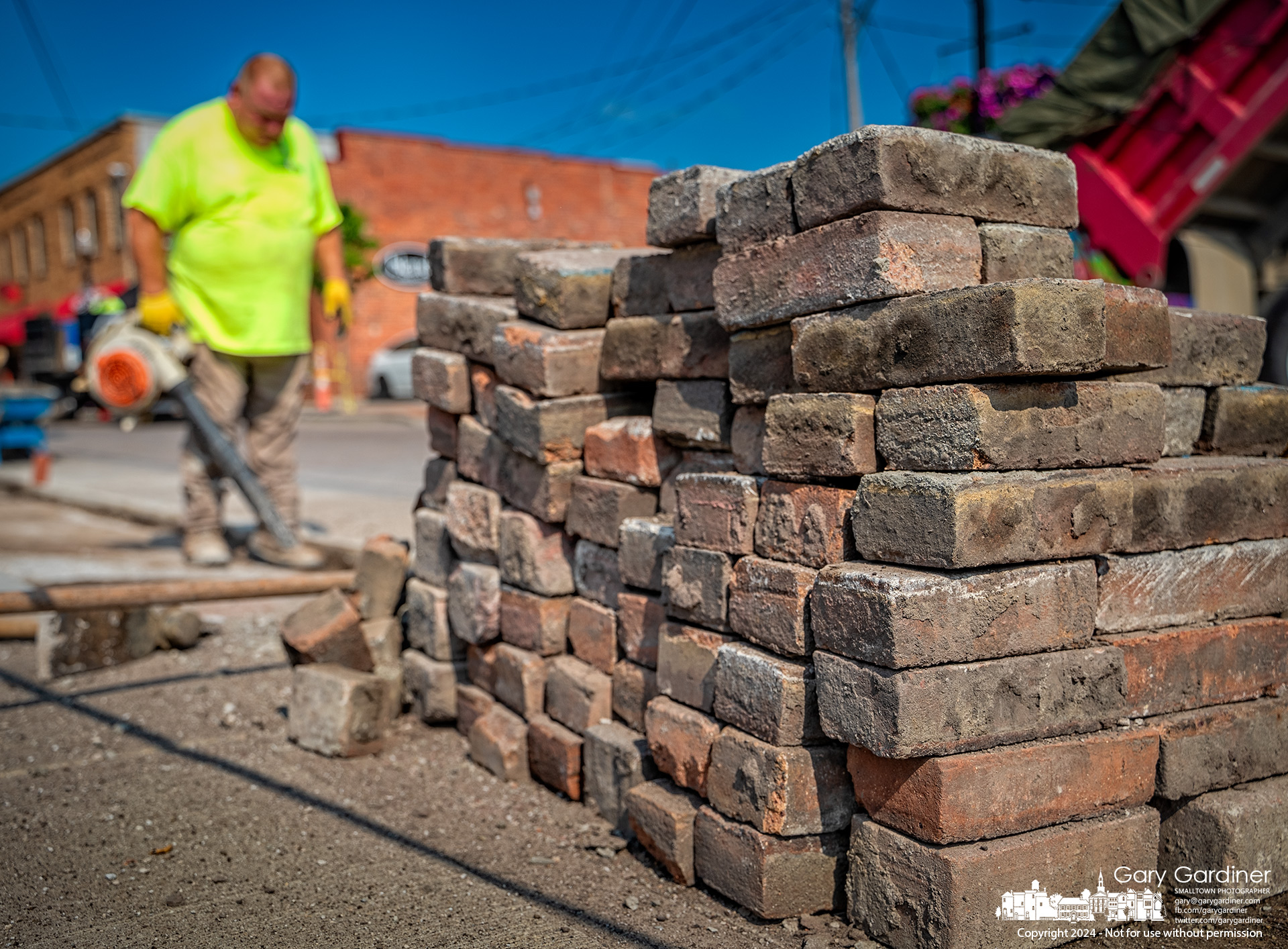 A stack of recycled pavers is waiting to be reinstalled at an entrance to a parking lot on East Main Street after sections of the cubs and gutters have been replaced. My Final Photo for July 23, 2024.