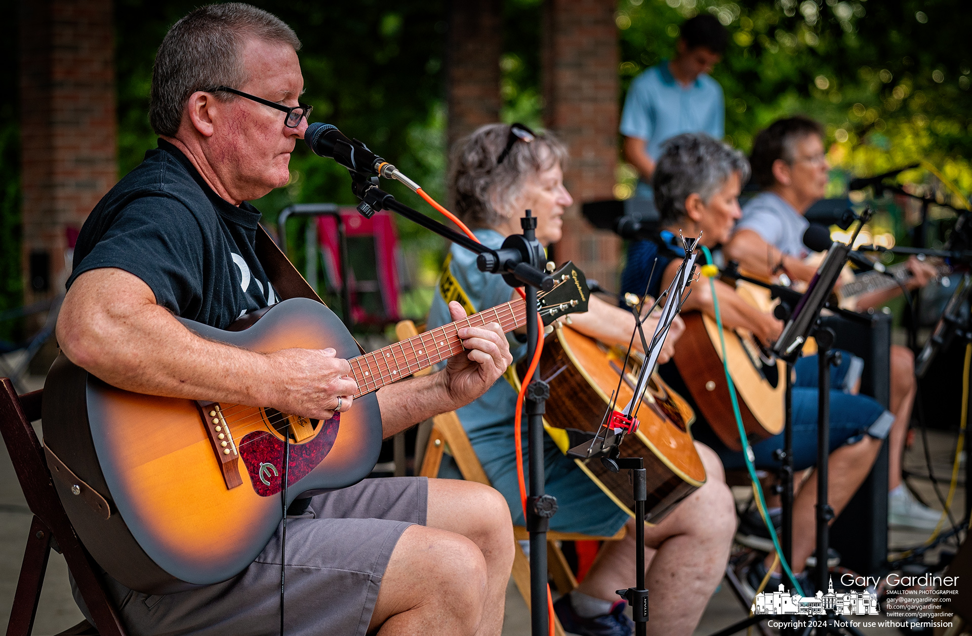 Seven guitarists, one bassist, a cuatro player, and a drummer gathered on the empty Alum Creek Park North Amphitheater stage for their eclectic bi-weekly performance of plucked string instrument music. My Final Photo for July 1, 2024.