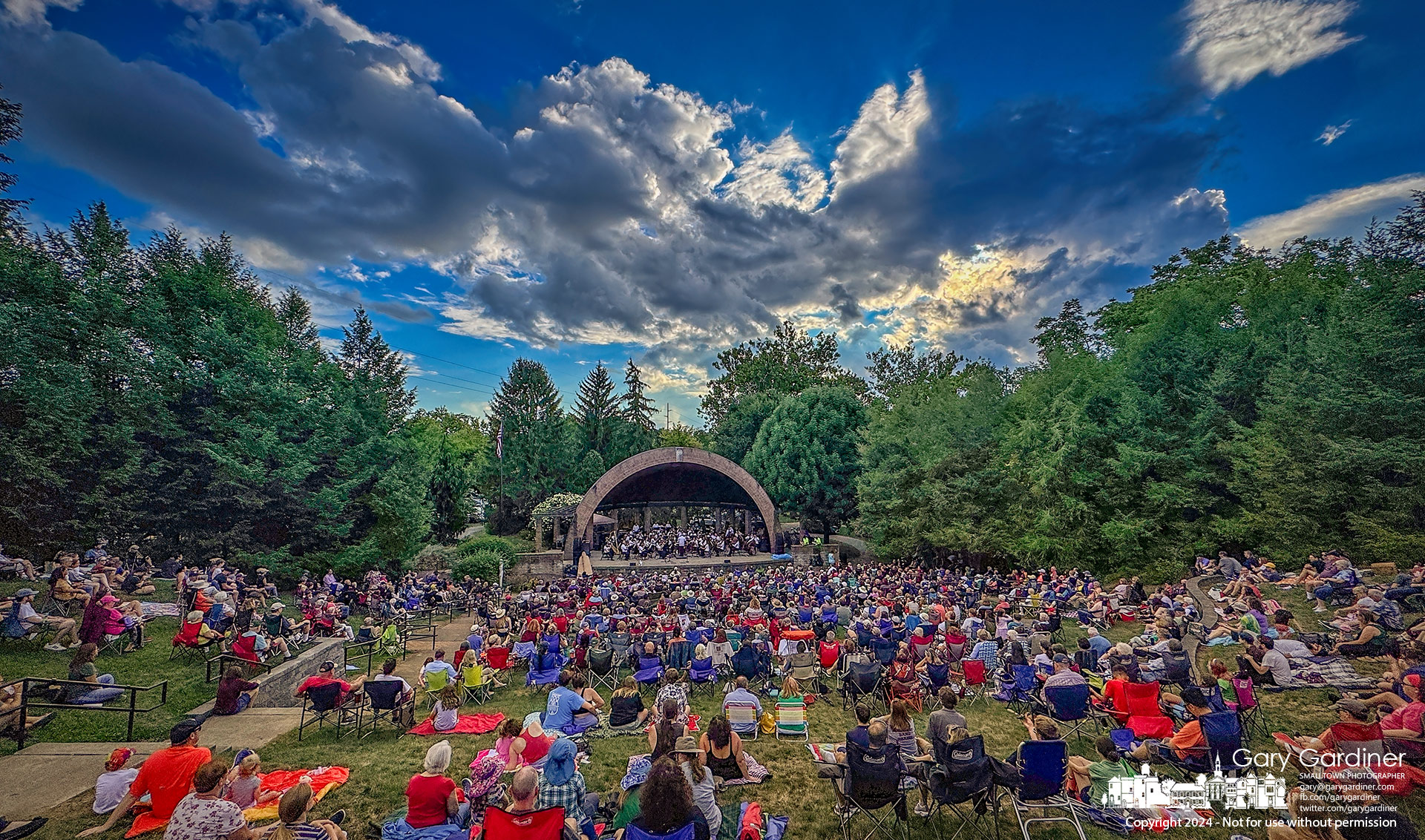 Clouds seemingly inspired by the majesty of composer John Williams's music move across the horizon as the Westerville Symphony performs a selection of Williams's music in the Alum Creek Amphitheater as part of the Sunday Concert Series. My Final Photo for August 18, 2024.