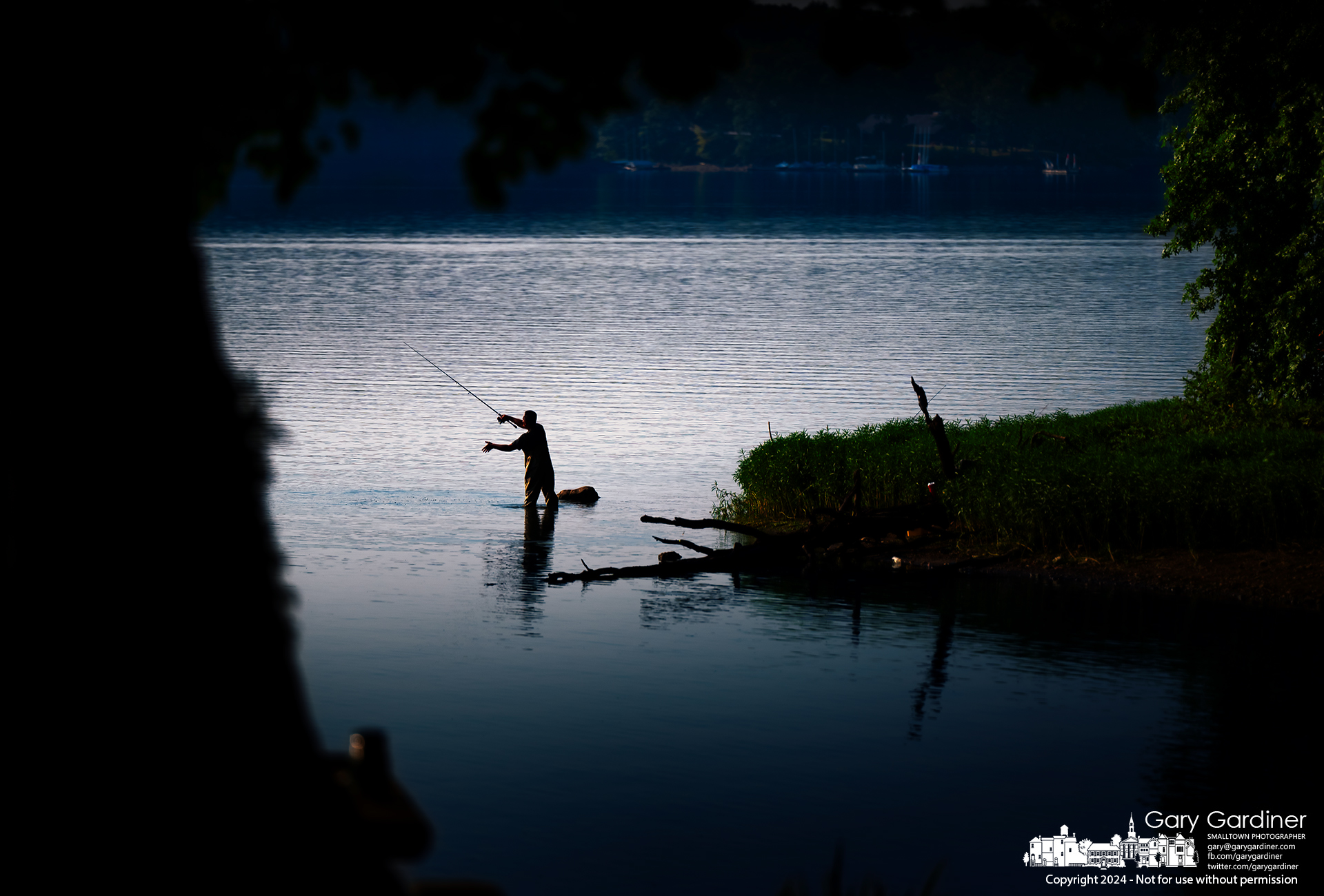 A fisherman stretched with both arms to lengthen his cast into the waters of Hoover Reservoir just after sunrise Sunday morning. My Final Photo for August 4, 2024.