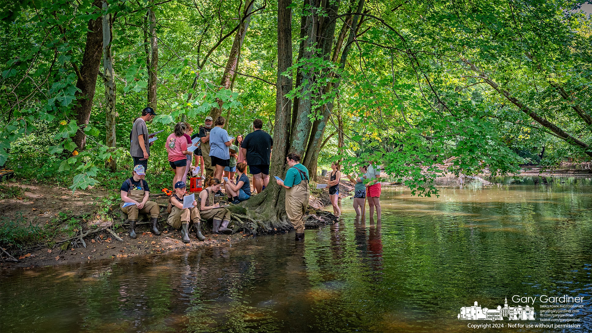 An Otterbein University science class stands on the banks of Alum Creek after a lesson in the ecology of the stream that runs through Westerville. My Final Photo for August 27, 2024.