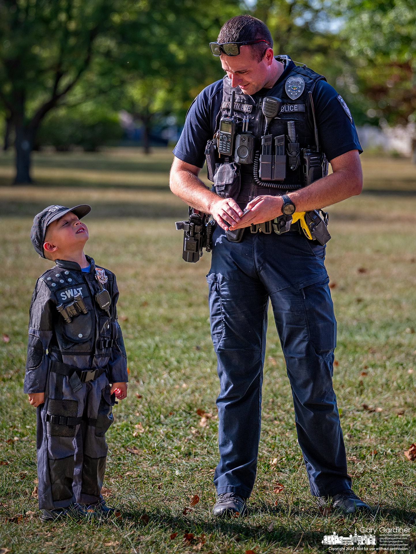 Westerville Police Officer Ryan Schleve talks with his kindergarten counterpart, 5-year-old Alan Lerner, a Mark Twain Elementary student, during the school's 50th-anniversary celebration. My Final Photo for September 12, 2024.