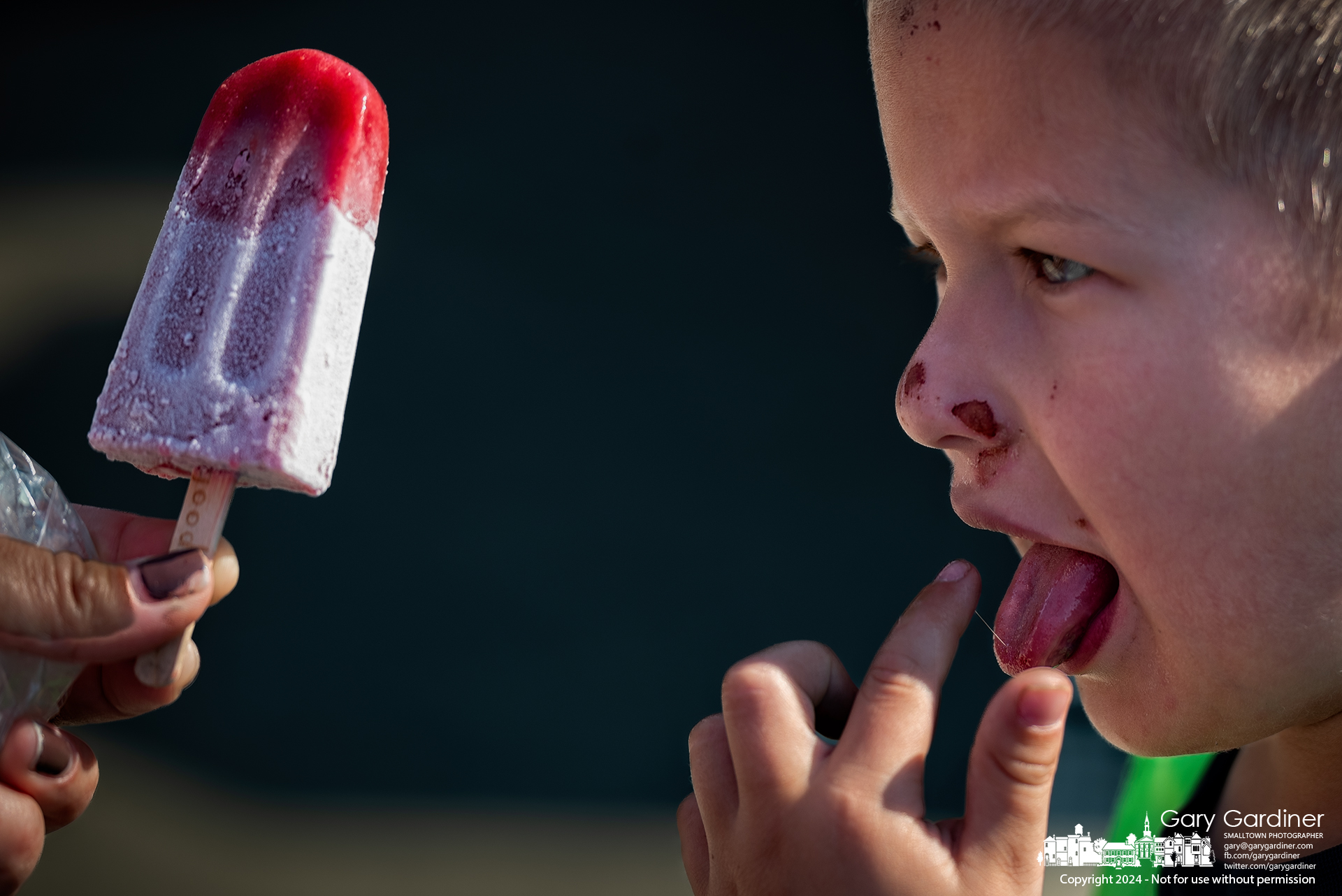 Noah Whitt, 5, ponders the effect of an ice-cold Too Good Eats pop on his tongue before taking another lick offered by his mother at the Saturday Farmers Market in Uptown Westerville. My Final Photo for September 14, 2024.