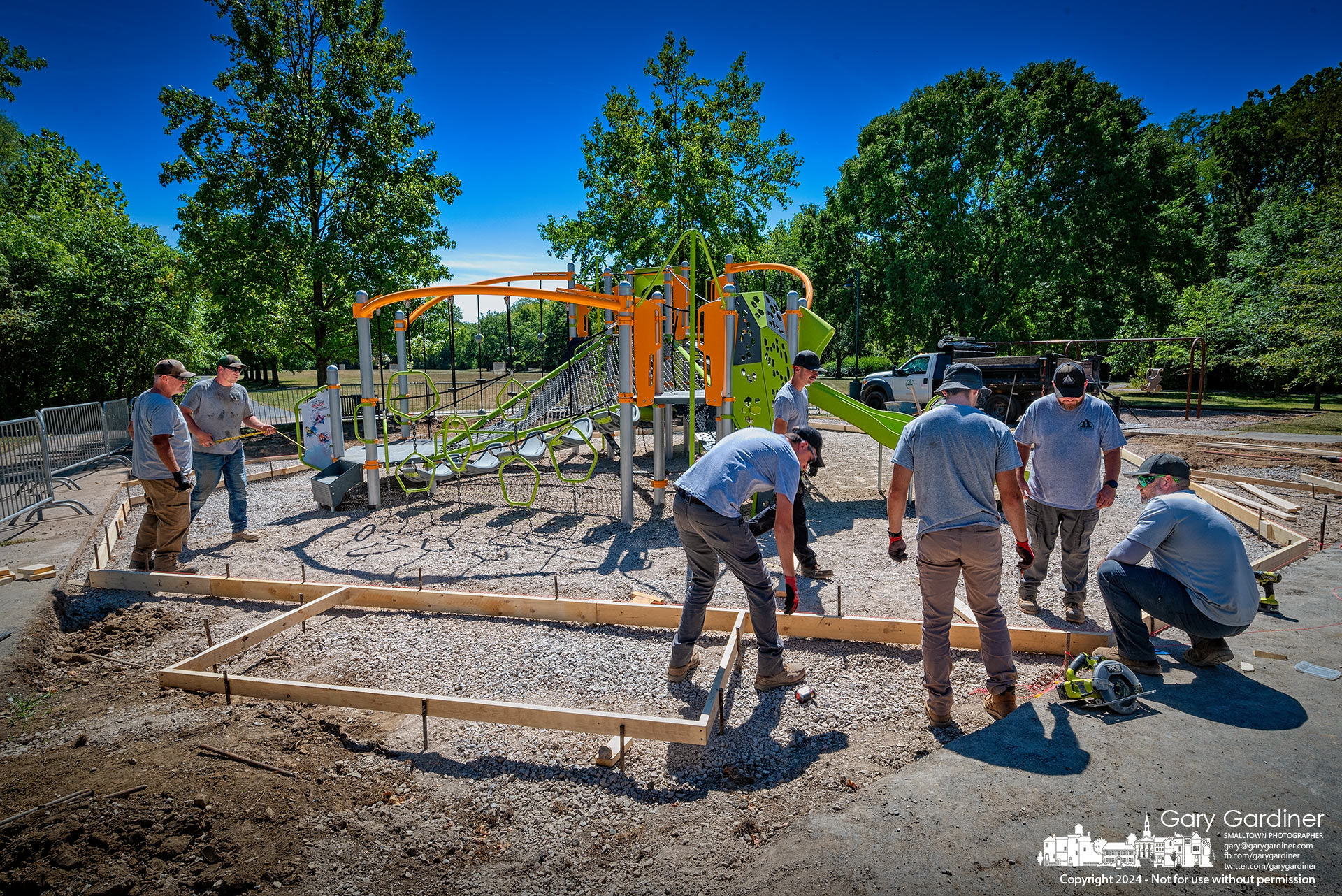 Westerville Parks workers build forms for concrete curbs and sidewalks around the newly installed playground at Heritage Park, replacing an older system that had outlived its best times for kids. My Final Photo for September 4, 2024.