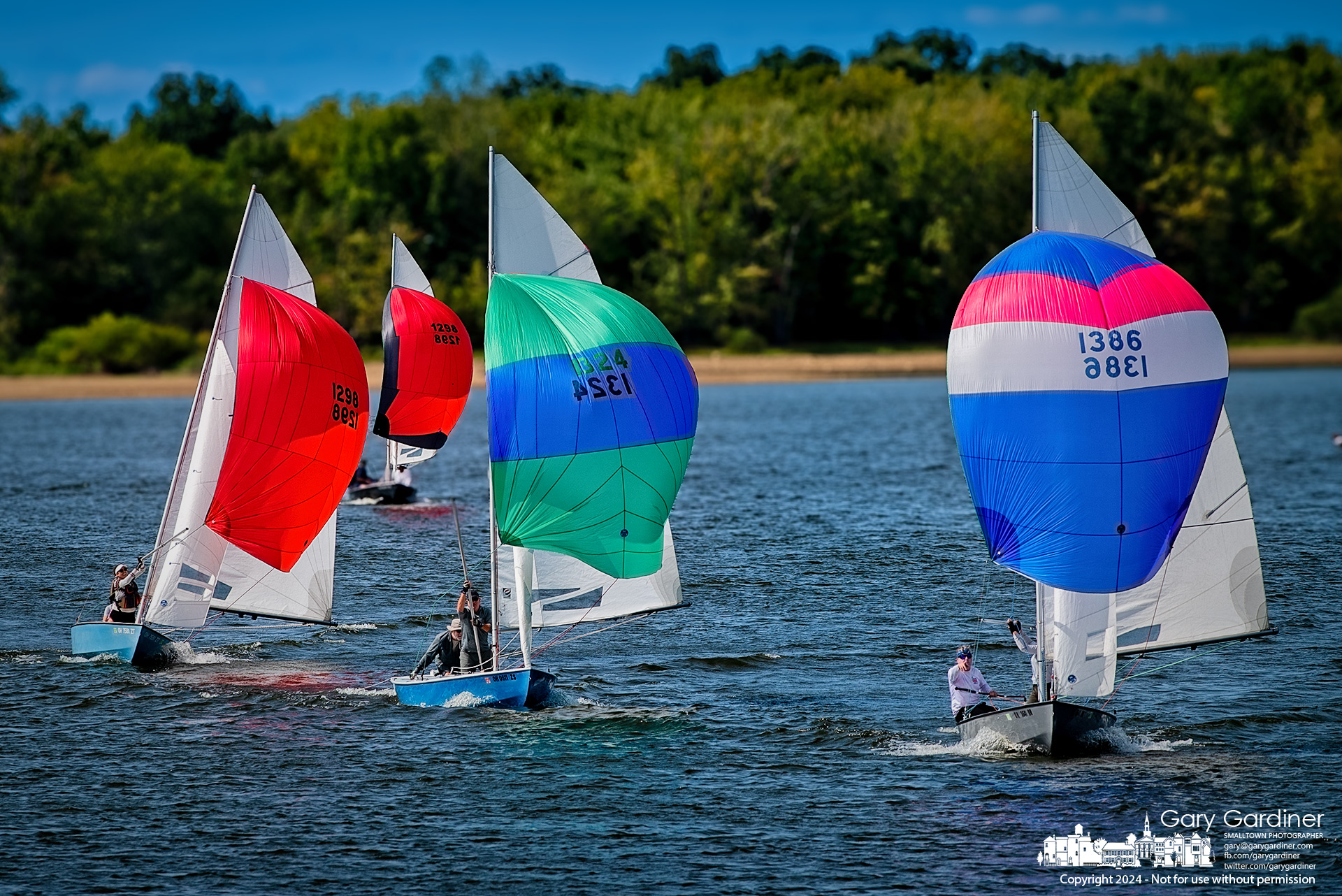 Sailors fly spinnakers with the wind, racing each other to the next buoy in a friendly race Sunday at Hoover Sailing Club on Hoover Reservoir. My Final Photo for September 8, 2024.