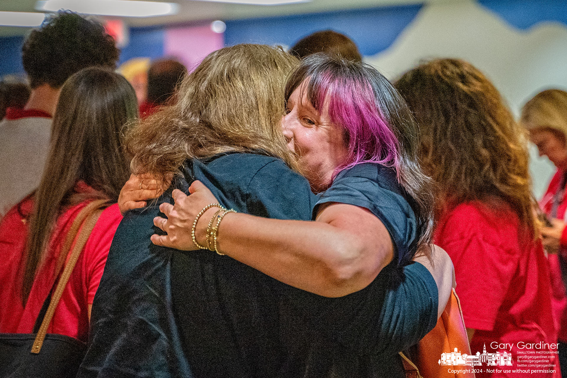 Opponents of a Westerville School Board policy allowing children to leave school for religious instruction hug after the board rescinded the policy Monday night. My Final Photo for September 30, 2024.