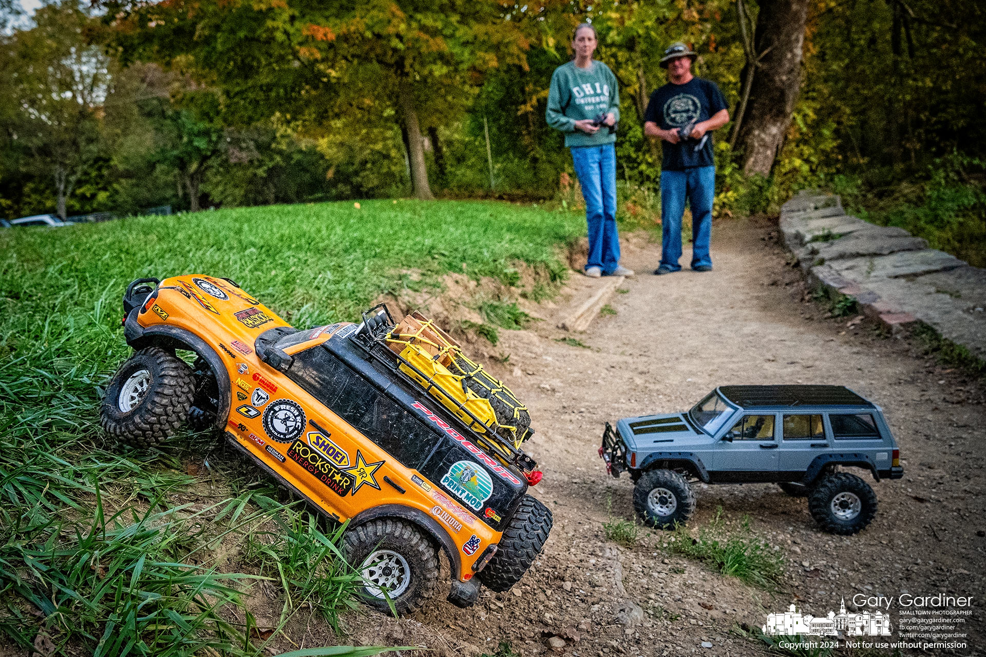 Karen Palmer and Doug Haubert run their custom-made remote-controlled vehicles across the terrain at the Alum Creek Park Dam in Westerville. My Final Photo for October 20, 2024.