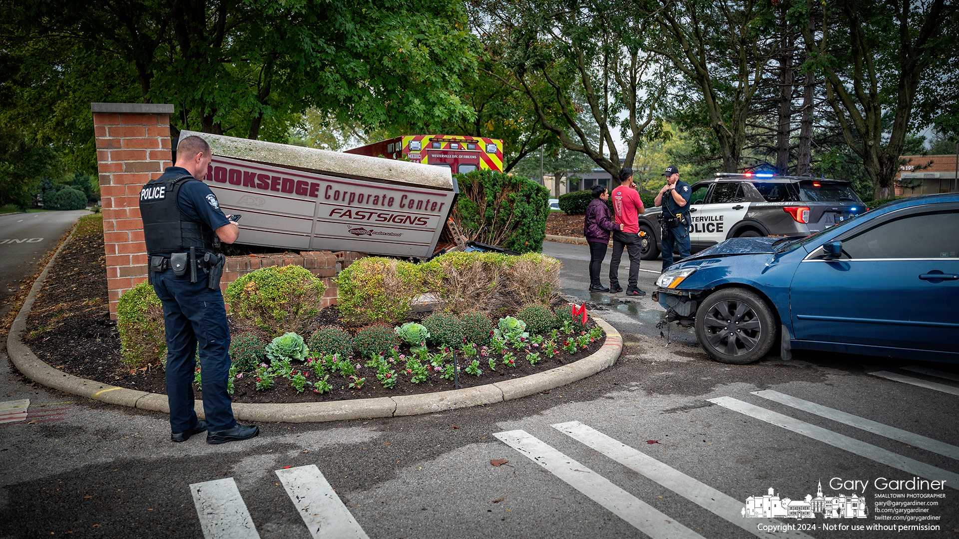 Westerville Police investigate a crash Wednesday when a car turned too wide onto Brooksedge from Schrock and struck the brick sign in the median. My Final Photo for October 2, 2024.