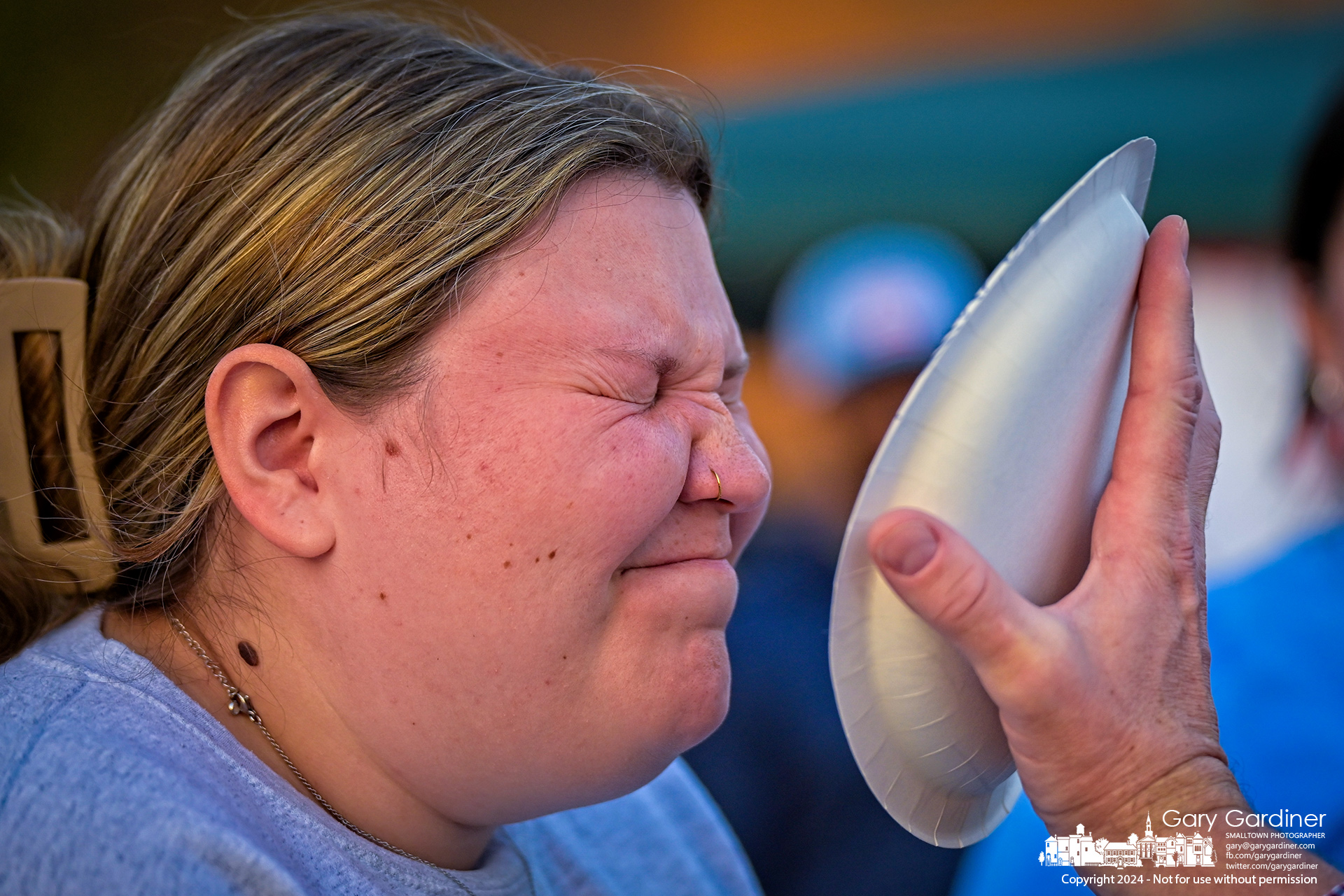 An Otterbein student scrunches her face just before getting a paper plate of whipped cream from a donor who made a cash contribution to Children's Hospital as part of the Otterthon Trunk or Treat event on campus Tuesday evening. My Final Photo for October 29, 2024.