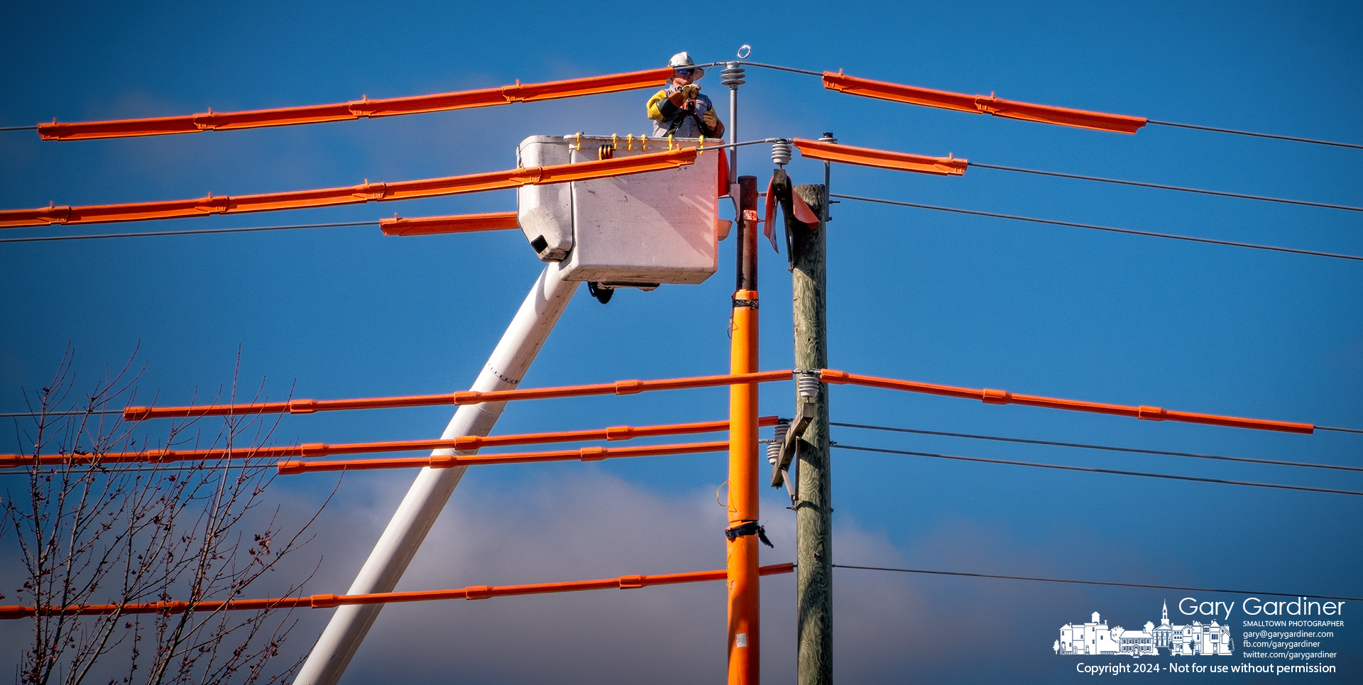 American Electric Power linemen switch electrical cables onto a replacement power pole on 3C Highway just north of Maxtown Road in Genoa Township. My Final Photo for November 12, 2024.