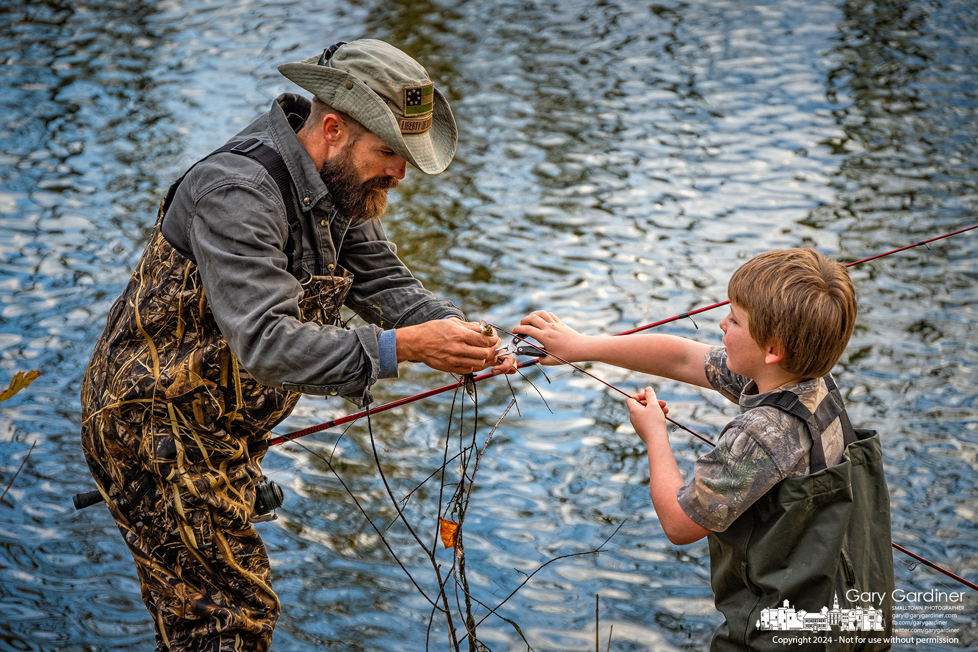 Father and son assist each other in clearing debris from the son's lure that retrieved a branch from the waters below the dam at Alum Creek North. My Final Photo for November 9, 20-24.