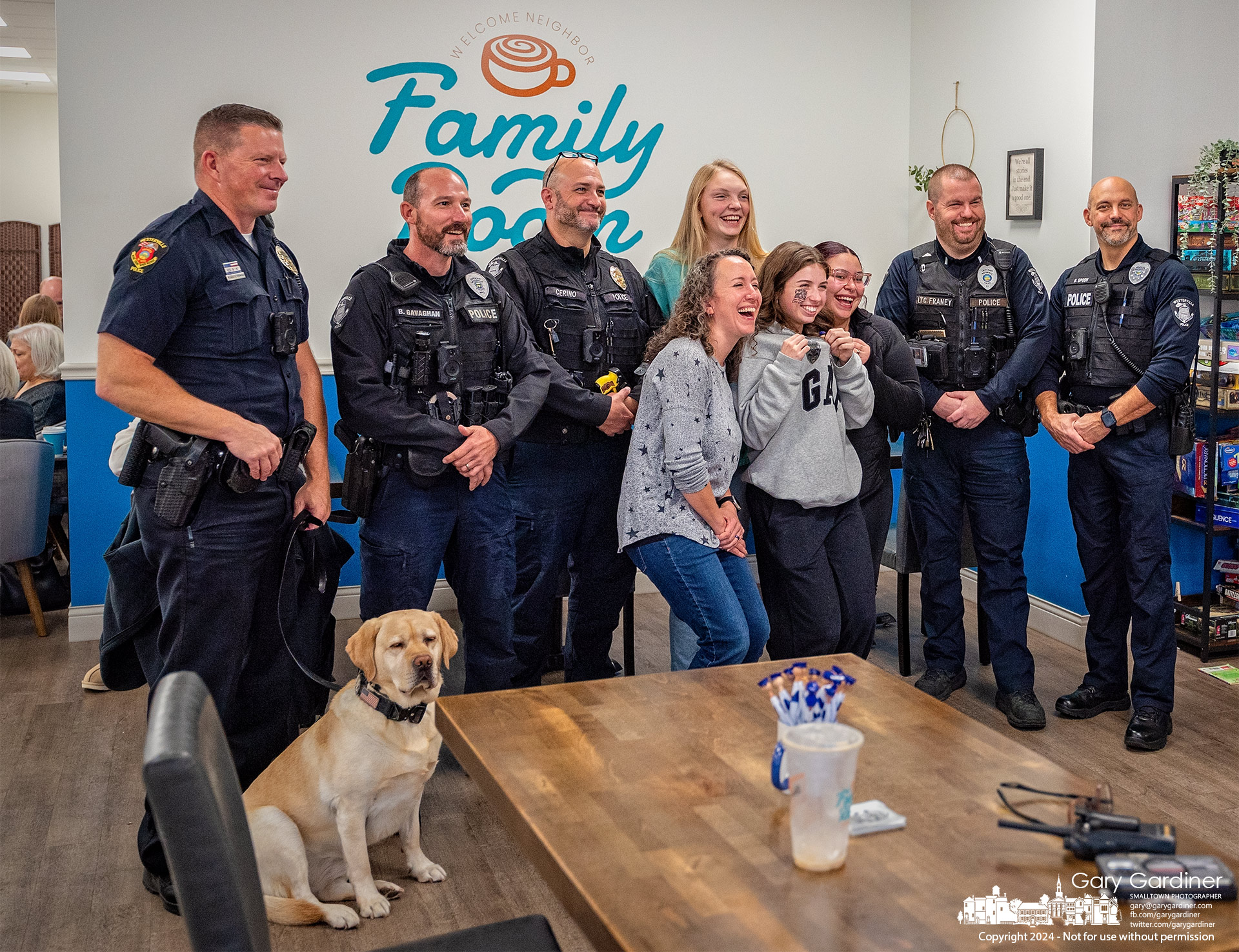 The staff at Family Room Coffee and Bakeshop pose with Westerville Police officers near the end of Coffee With Cops at the shop on South Otterbein Ave. My Final Photo for November 15, 2024.