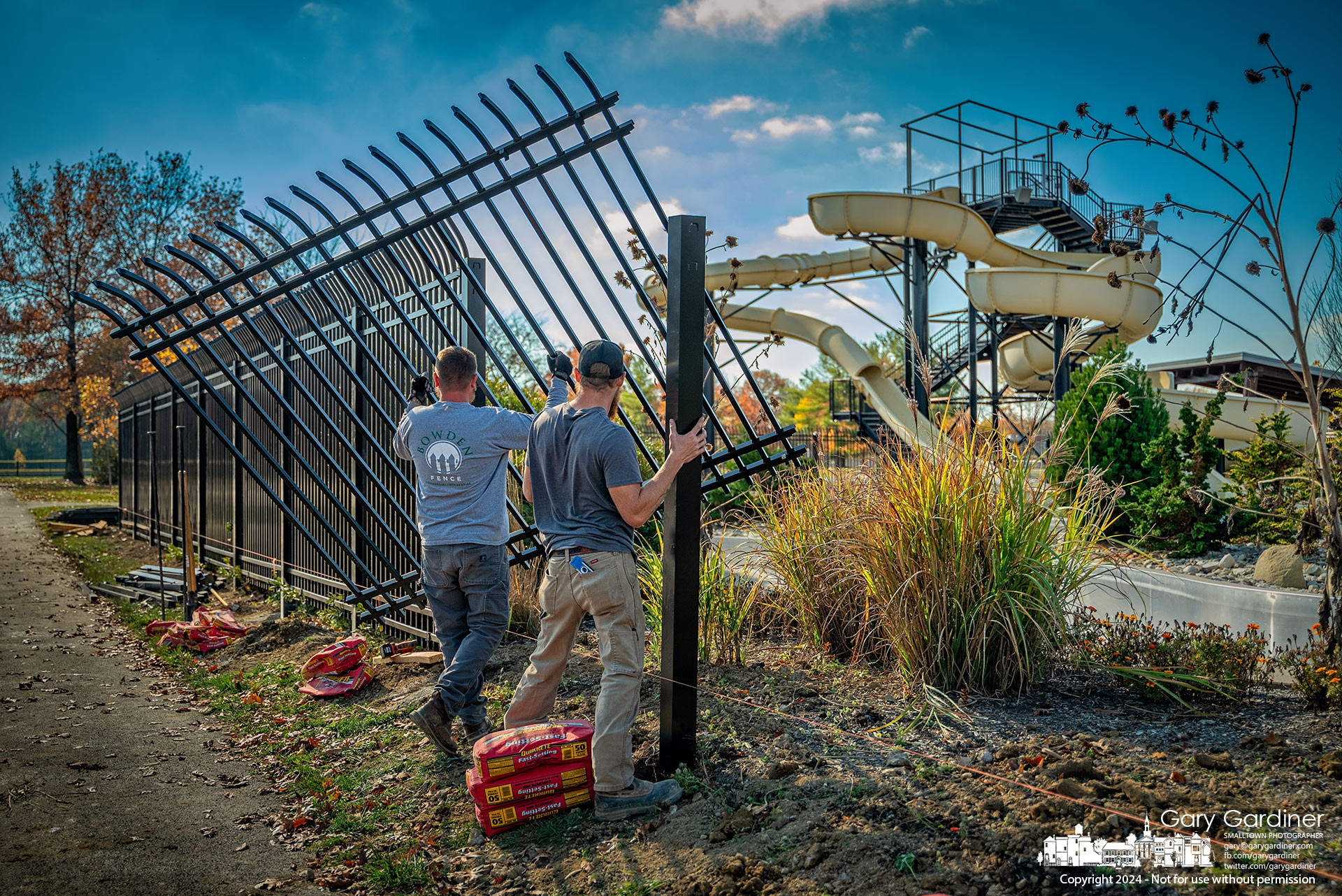 Workers install the final sections of the security fencing around Highlands Pool, completing the installation that began in May and was suspended during the summer. My Final Photo for November 7, 2024.