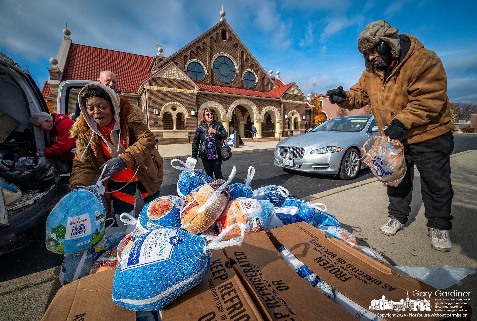 St. John Community Kitchen volunteers gather frozen turkeys donated by St. Paul the Apostle Catholic Church parishioners in an annual pre-Thanksgiving program to help fund the kitchen for the holidays. My Final Photo for November 24, 2024.