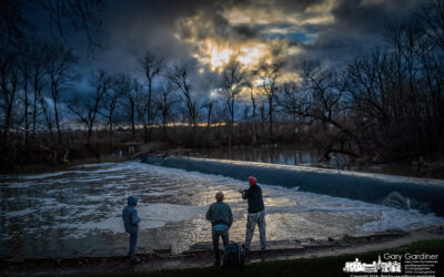 Comparing Fishing Notes At Sunset