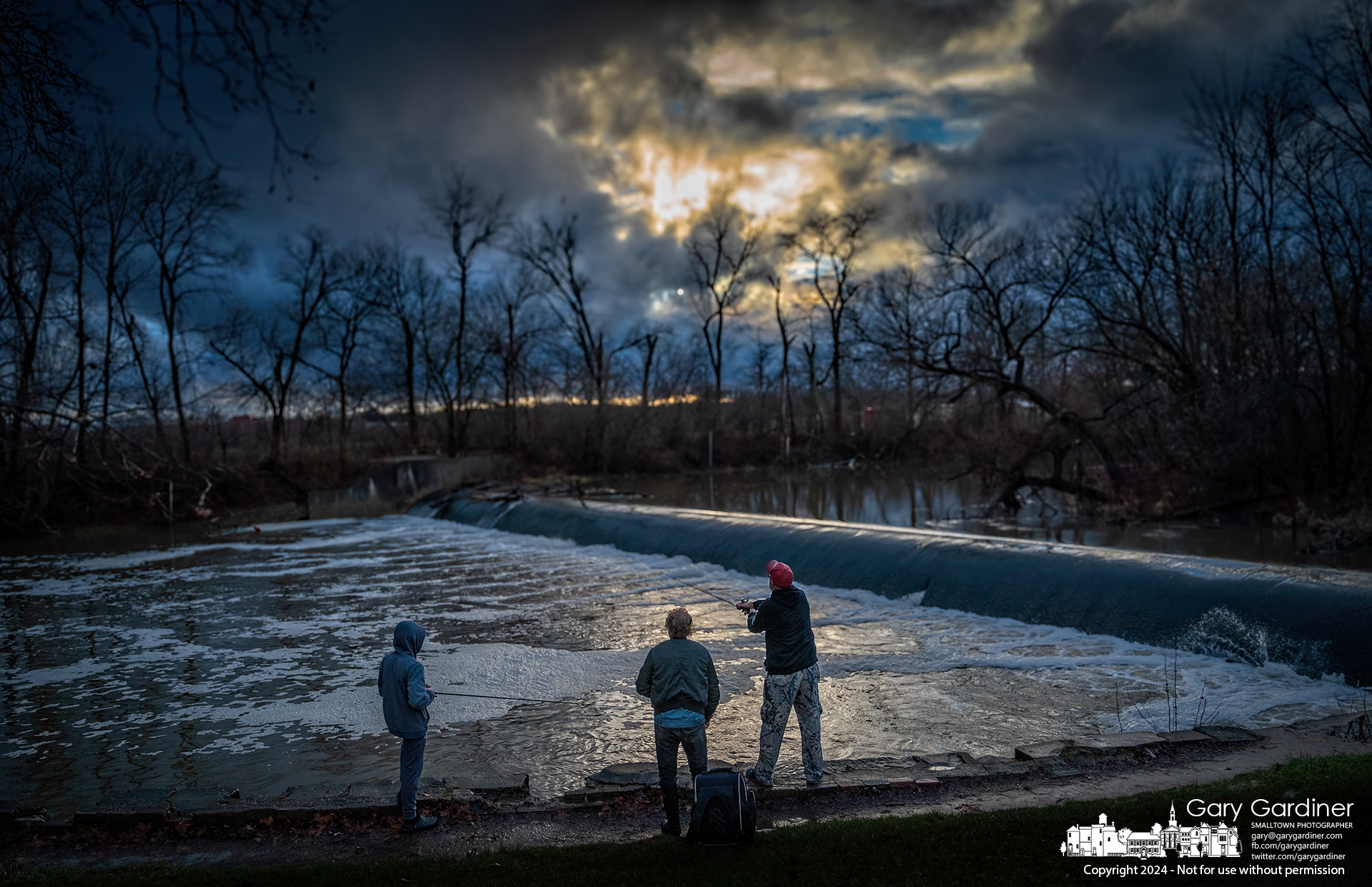 Three fishermen compare notes on the roiling waters below the Alum Creek North lo head dam after rains increased flow over the dam, increasing the opportunity for better fishing as all anglers hope for after a winter rainstorm. My Final Photo for December 29, 2024.