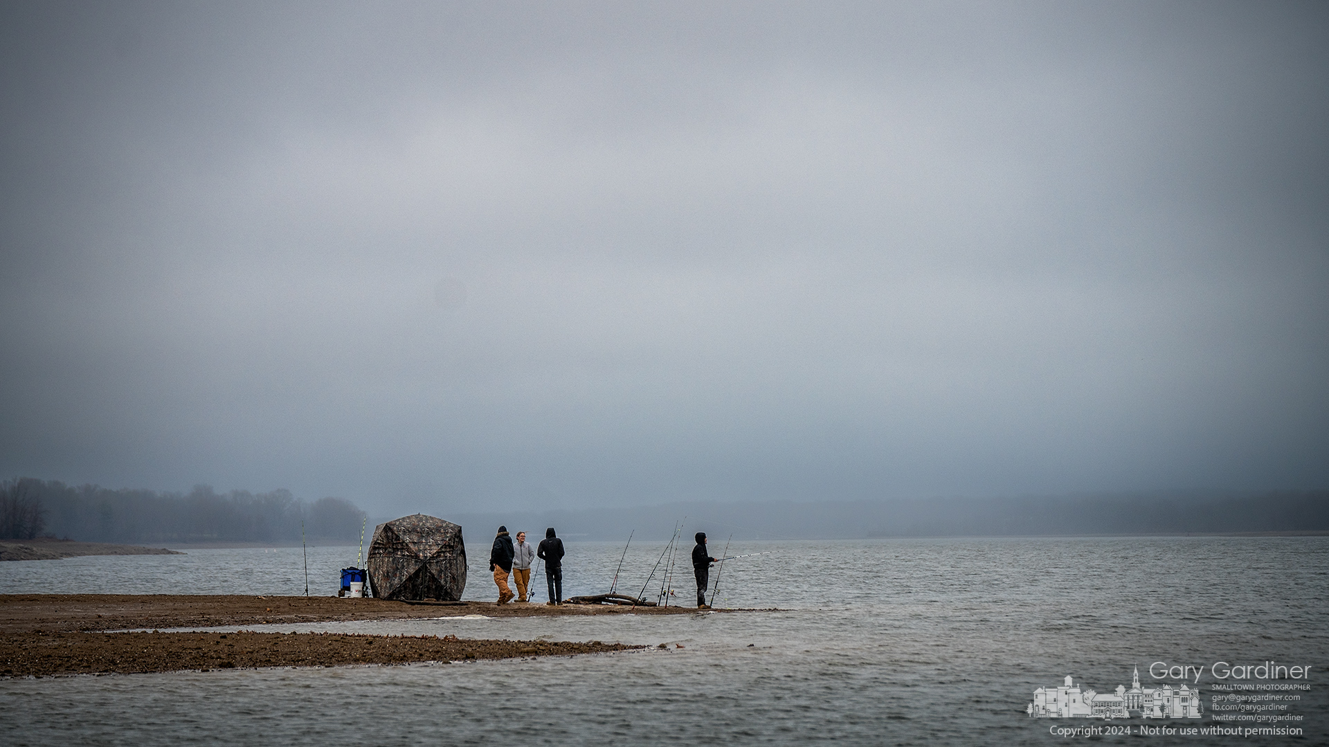 A quarter of anglers from Findlay pitch their tent, and an abundance of rods are baited for blue catfish as they settle into an overnight stay along the near-historic low waters of Hoover Reservoir. My Final Photo for December 15, 2024.