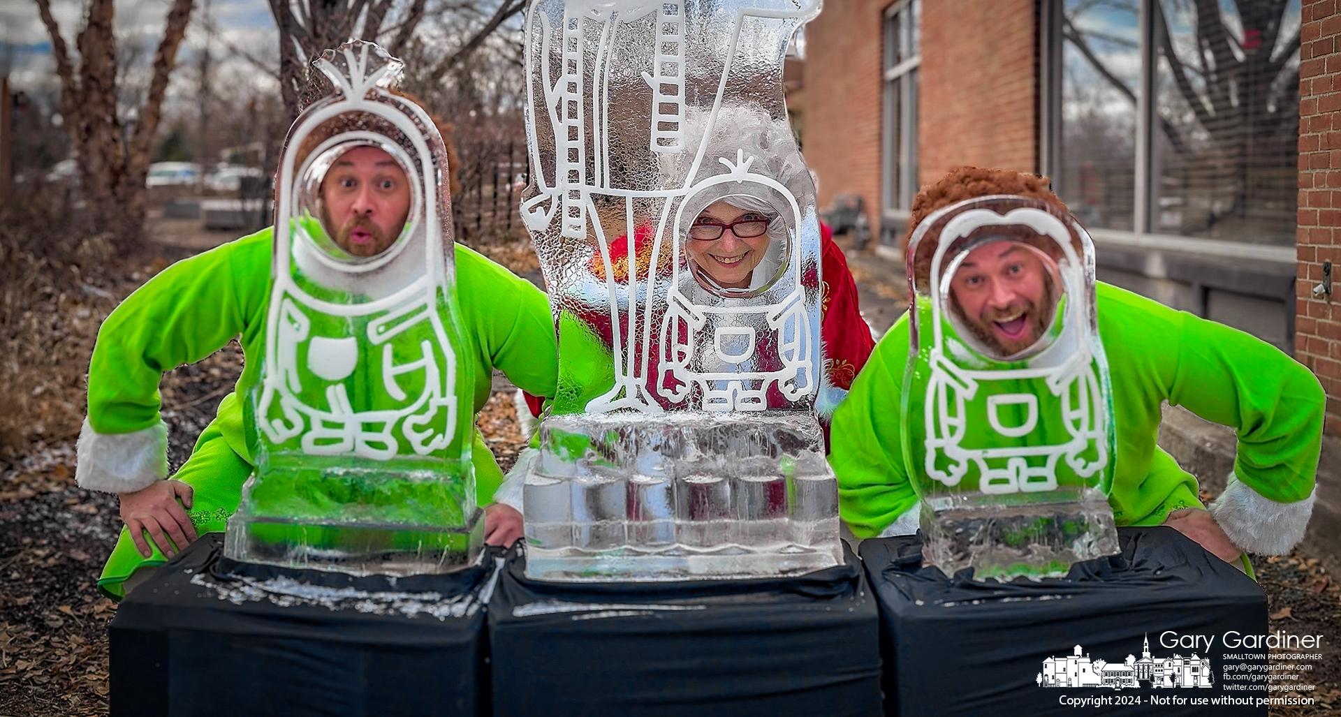 Mrs. Claus takes the center position sandwiched between an elf who took the opportunity to make sure he was seen more than her at the Minions ice sculptures in Uptown Westerville Saturday afternoon. My Final Photo for December 22, 2024.