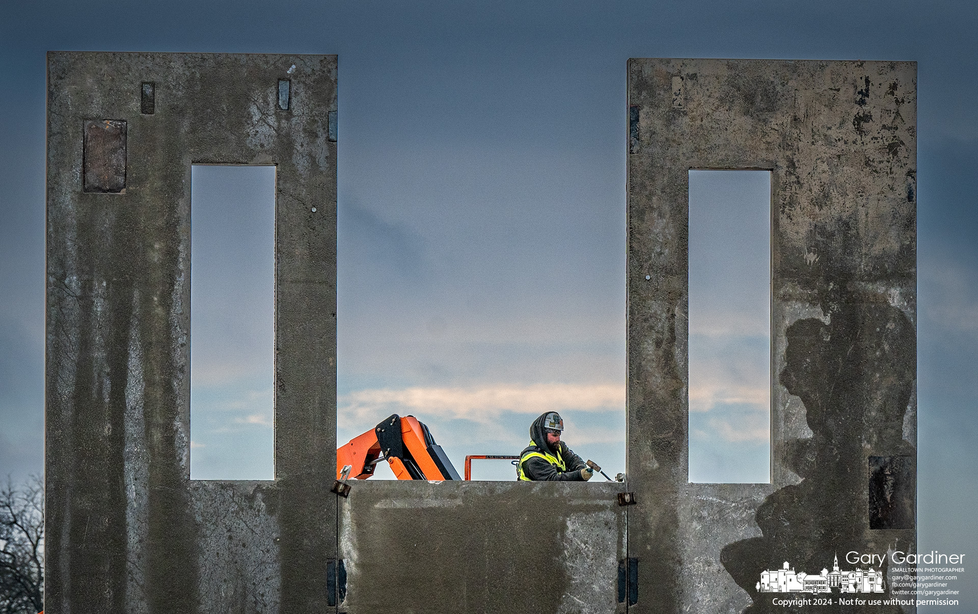 A steel pin is hammered into the joint of one of the preformed steel-reinforced wall panels that will become the structure for Smash Park, a new sports complex at the corner of Cleveland Ave. and Polaris Parkway. My Final Photo for December 18, 2024.