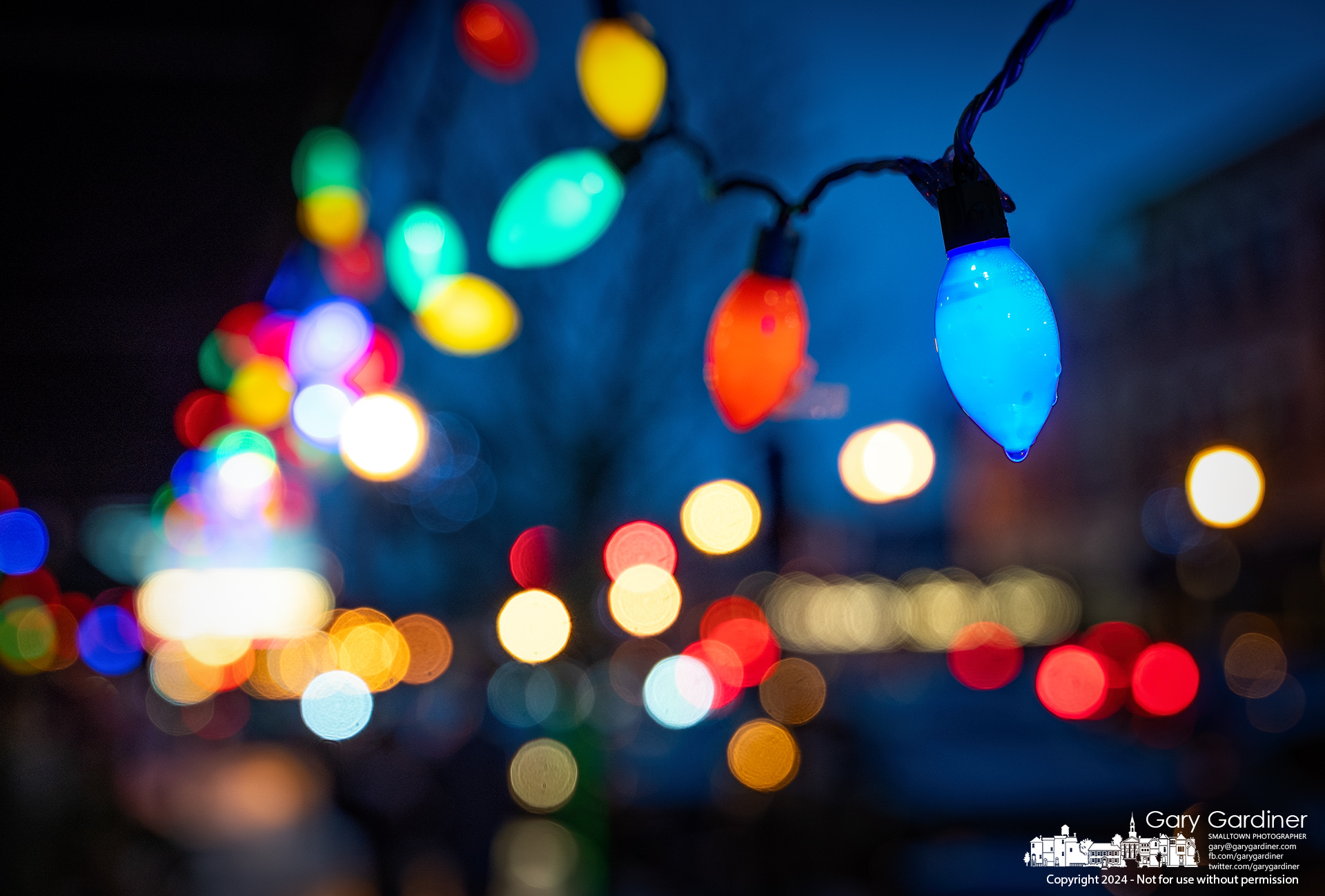 Rainwater drips from Christmas lights hanging from the Old Bag of Nails awning in Uptown Westerville. My Final Photo for December 10, 2024.