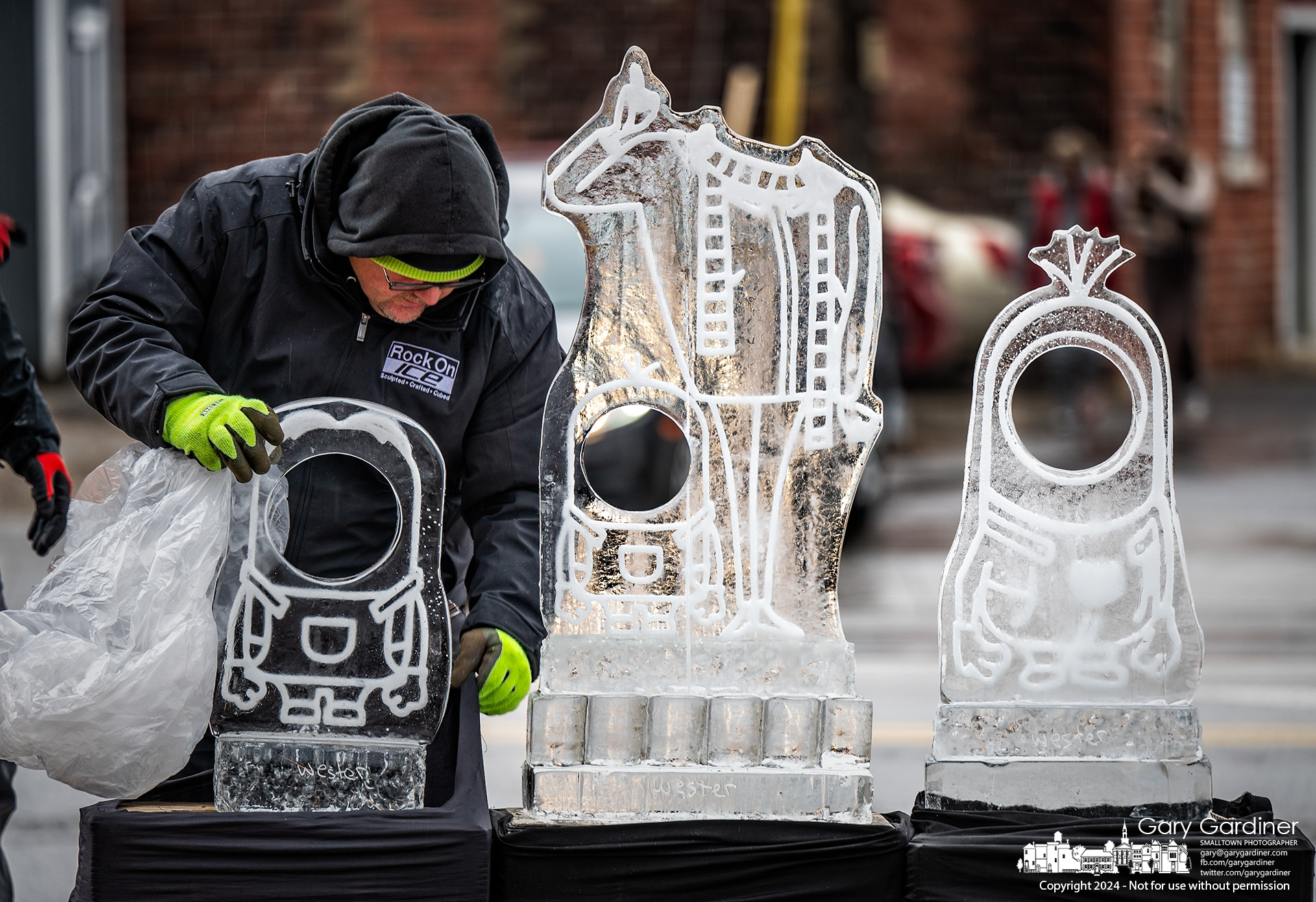 Ice sculptures fashioned after Minion cartoon characters are placed on pedestals in Uptown Westerville as three of the collection of frozen treats decorating the sidewalks the weekend before Christmas. My Final Photo for December 20, 2024. 