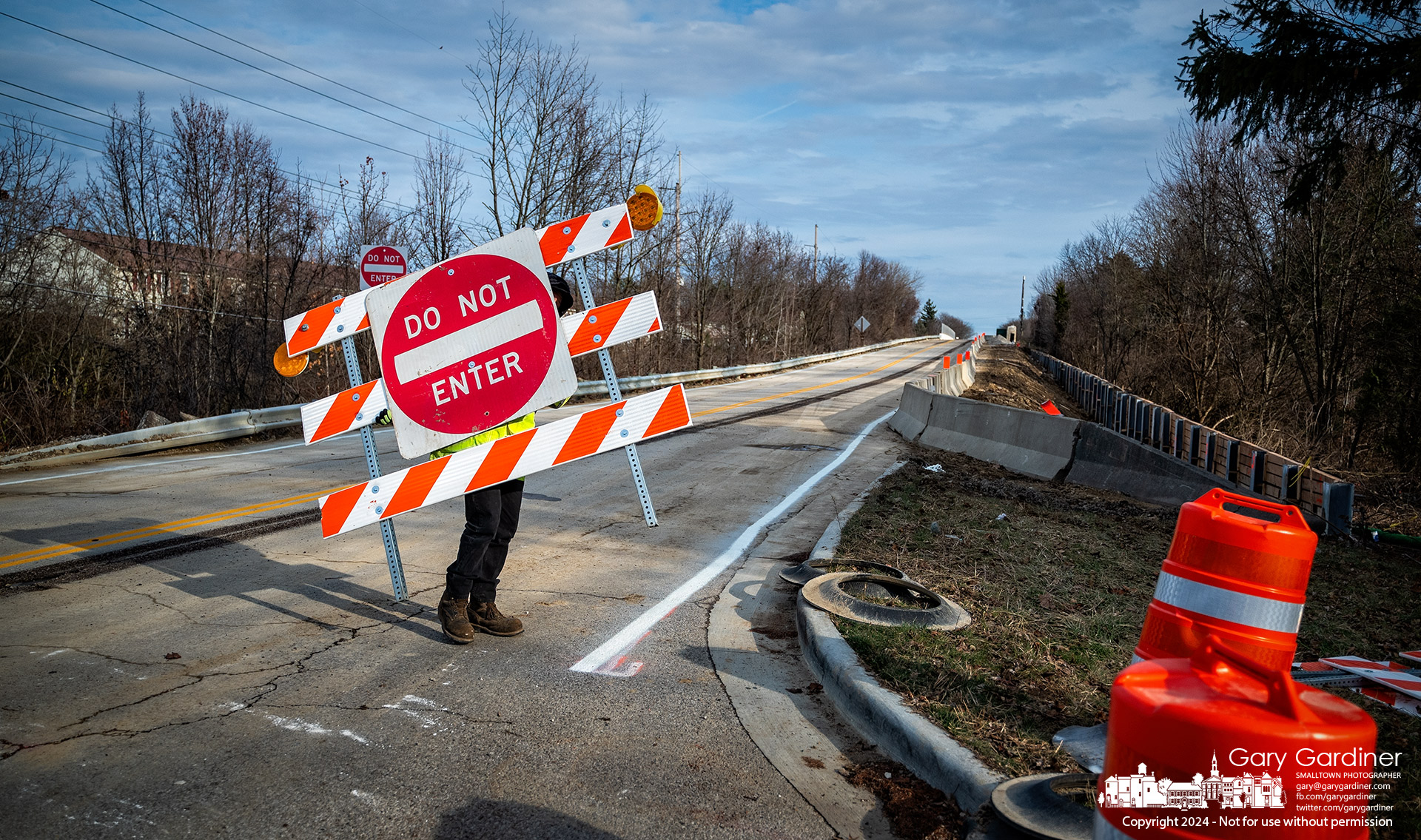 Barriers blocking West Main and Park Road over I-71 are removed Monday afternoon after the road was temporarily restriped for two-way traffic during a break in construction for the next two weeks. My Final Photo for December 23, 2024.