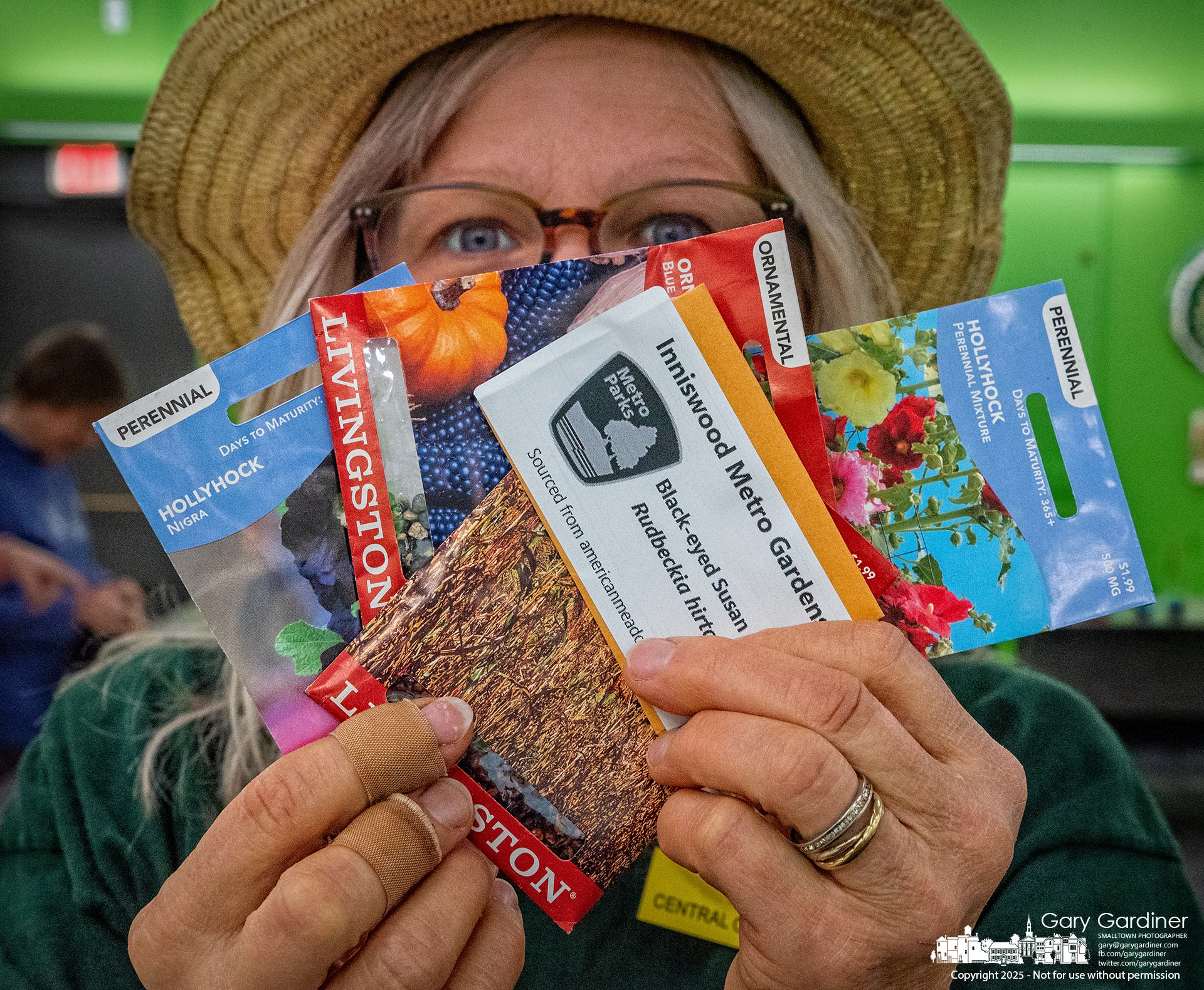 Carole Bond holds some of the seeds given away by the Inniswood Garden Society as part of the Westerville Library's seed giveaway on Saturday. My Final Photo for January 25, 2025.