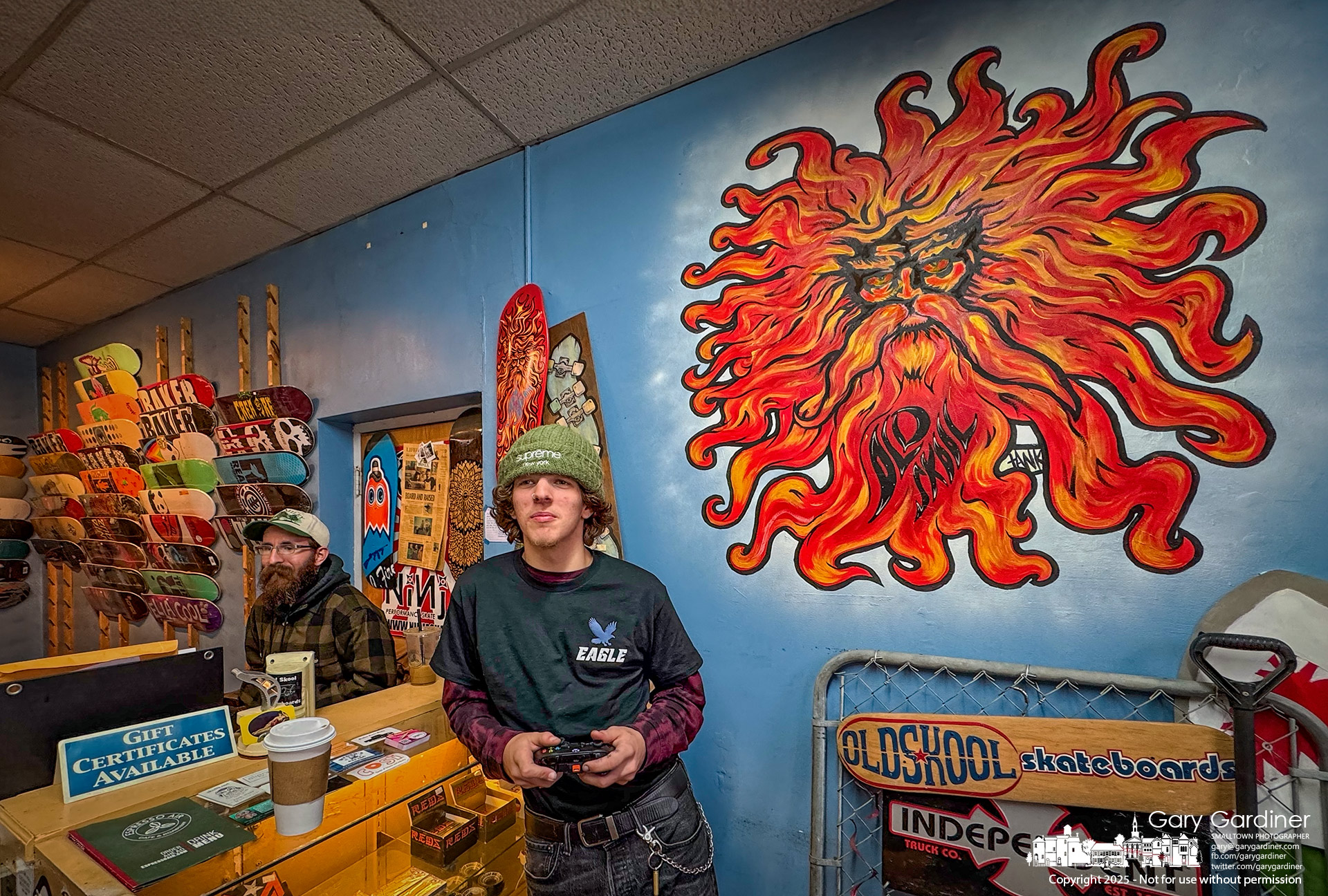 Skaters, kept out of the skatepark by the winter storm and brutally cold temperatures, settle for the second choice, video gaming in OldSkool at a skate park in Hawaii. My Final Photo for January 23, 2025.