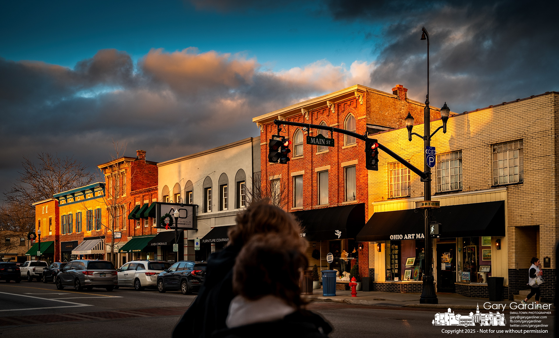 After sharing a kiss at the corner of State and Main, a romantically inclined couple turns to the sunset lighting the eastern sky and skyline before crossing the street in Uptown Westerville. My Final Photo for January 2, 2025.