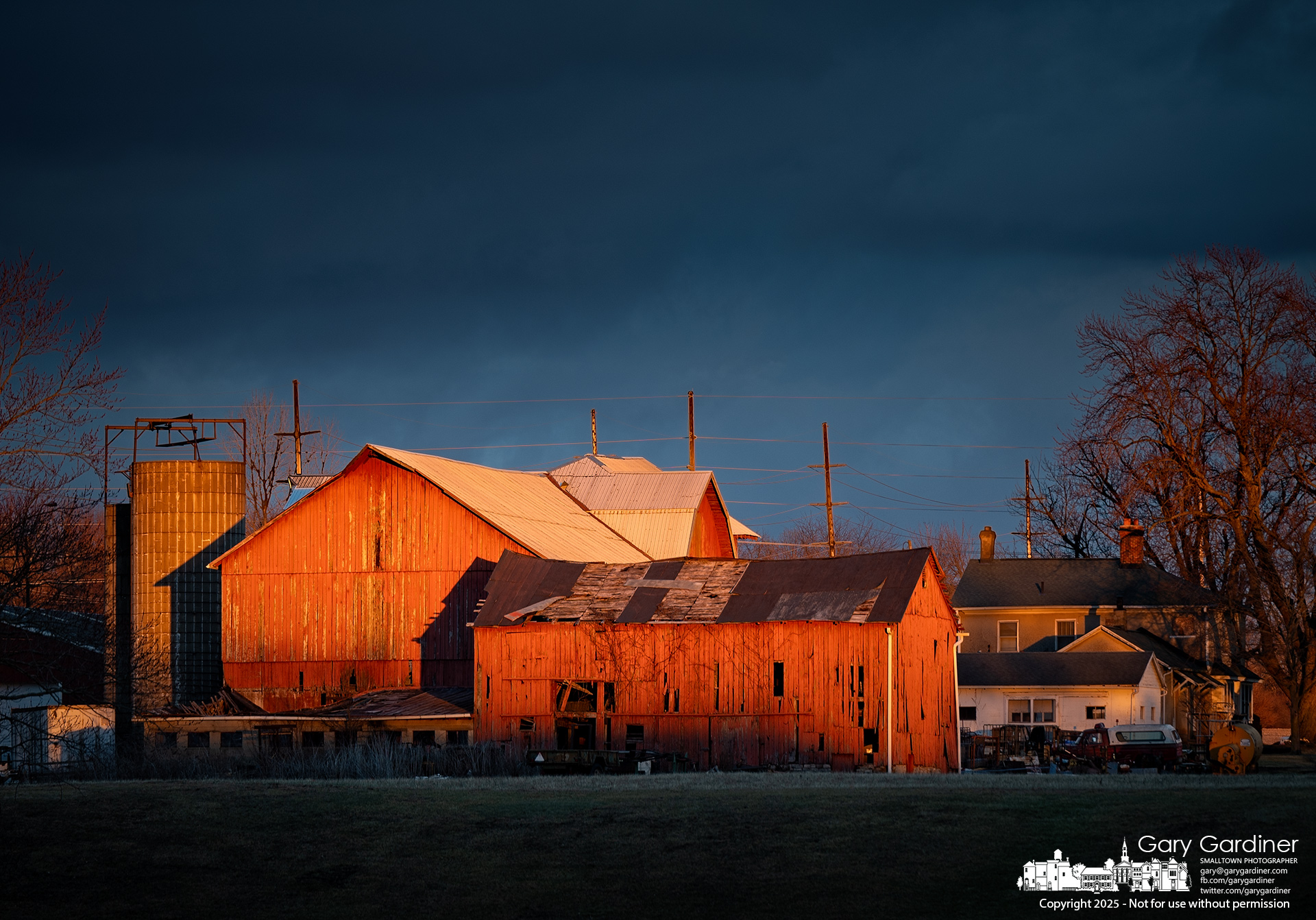 Shadows that follow sunset creep up the barn and home at the Yarnell farm on Africa Road. My Final Photo for January 31, 2025.