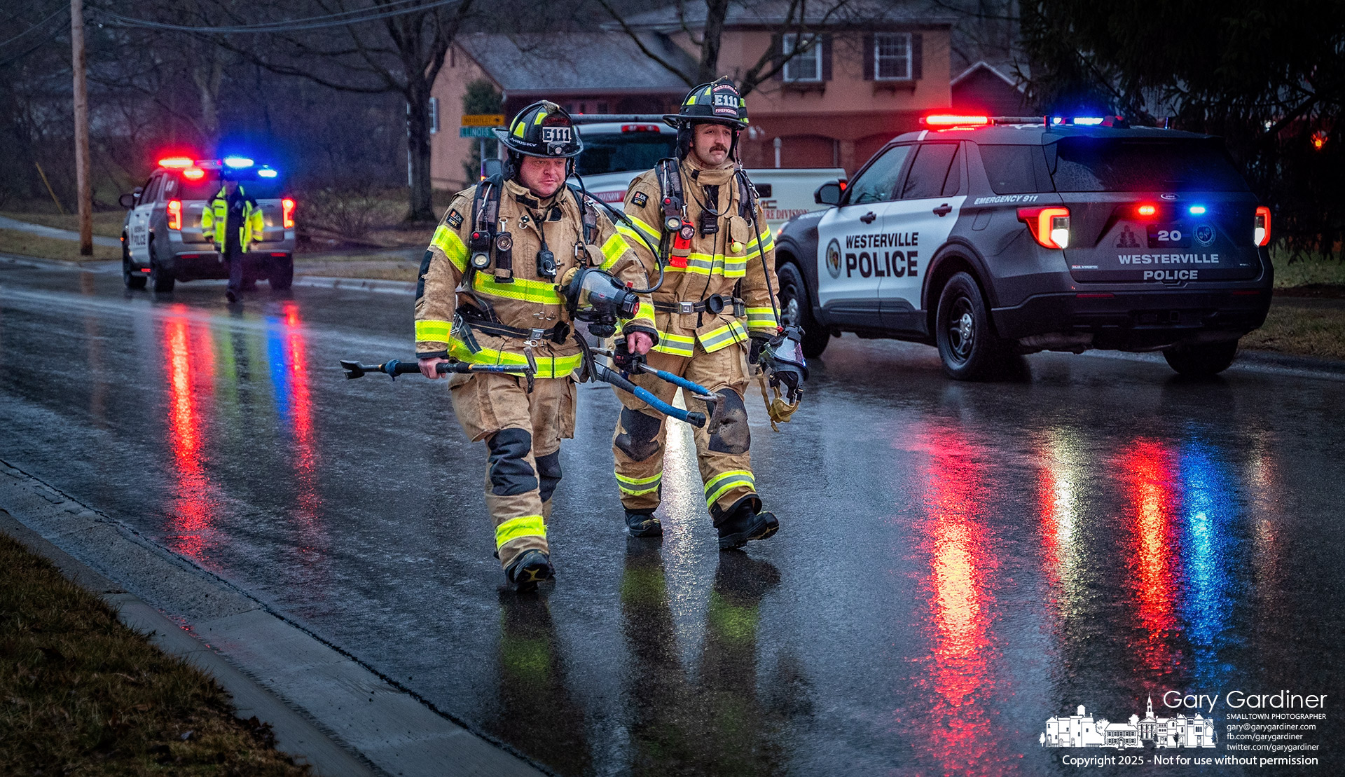 Westerville firefighters walk through the rain back to their truck after a brief run to what was discovered to be a minor fire in a dryer duct. My Final Photo for February 12, 2025.