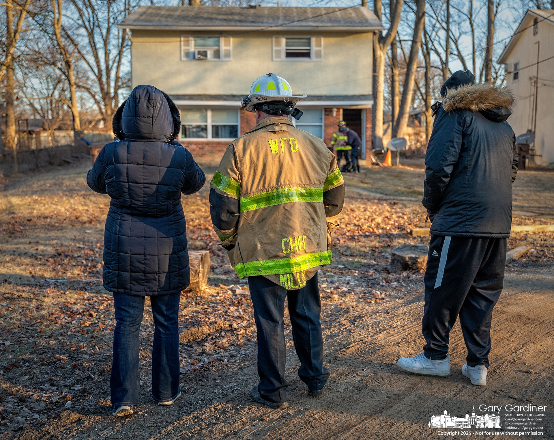 Westerville Fire Chief Brian Miller explains the condition of their homes to Blendon Township residents of a duplex on Kilbourne Ave. that was damaged in a morning fire. My Final Photo for February 10, 2025.