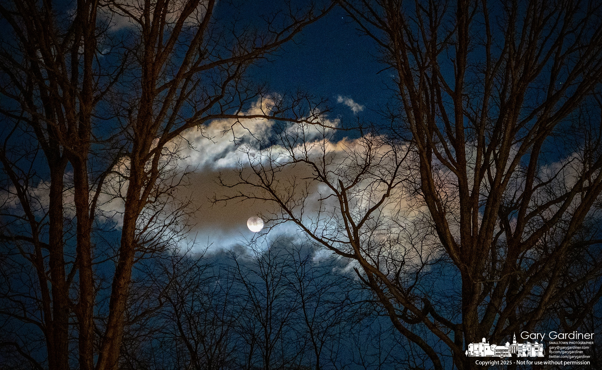 The waning Snow Moon briefly emerges from behind fast-moving clouds on its first night after Thursday’s afternoon full moon, which had been obscured by cloud cover in the western sky after sunset. My Final Photo for February 13, 2025.