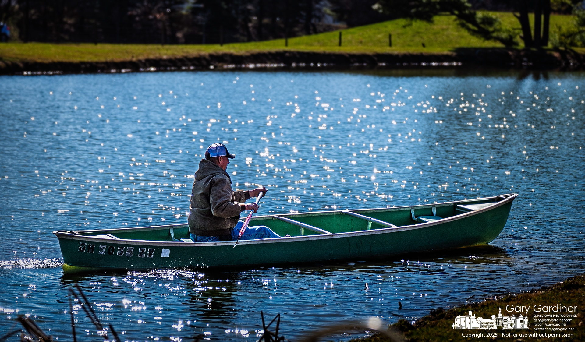 Duane Yarnell returns to shore after inspecting objects in the farm's pond on County Line Road. My Final Photo for March 17, 2025.