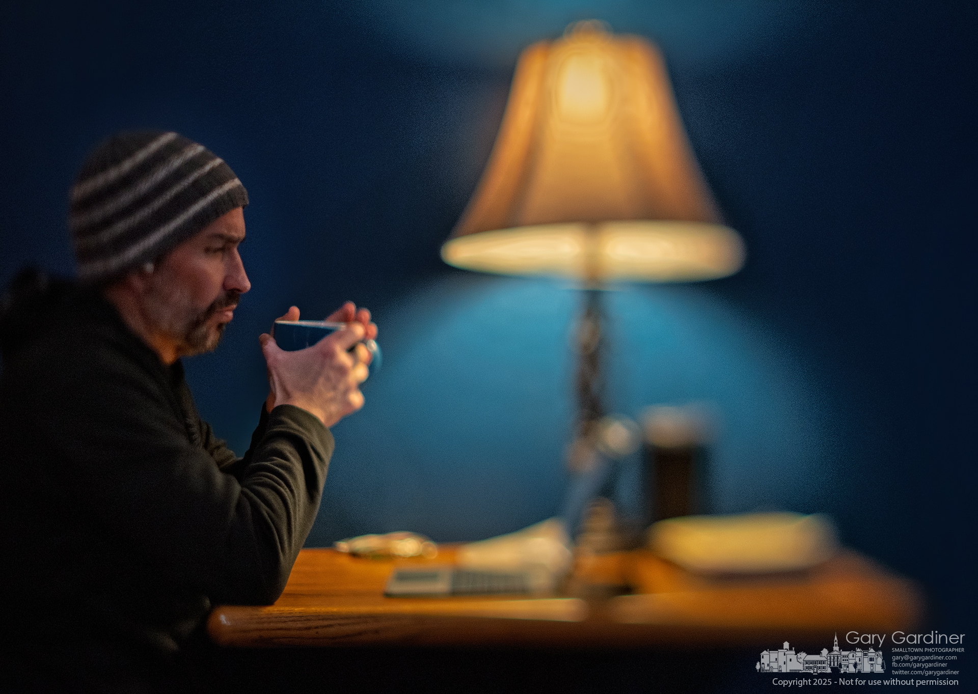 A man enjoys his coffee as he begins his Bible study readings at the start of open mic night at Java Central in Uptown. My Final Photo for March 7, 2025.