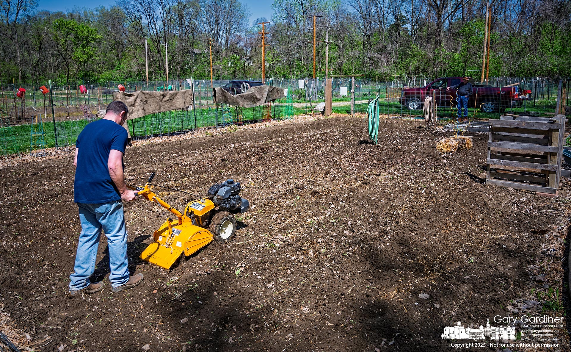Gardeners have begun preparing their community garden plots, taking advantage of cool spring temperatures to till the ground for later planting. My Final Photo for April 27, 2025.