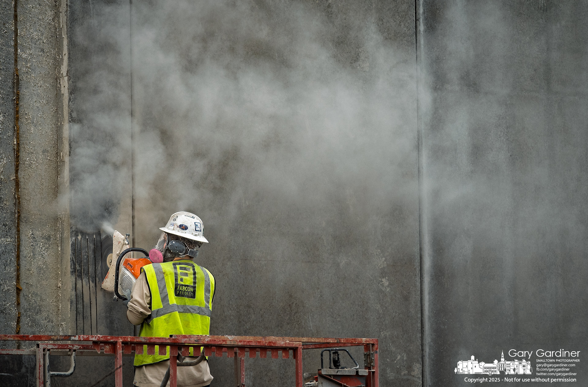 A worker carves lines and ridges into preformed exterior panels to simulate windows at Smash Park, an indoor-outdoor entertainment complex under construction at Polaris and Cleveland Avenue. My Final Photo for April 14, 2025.