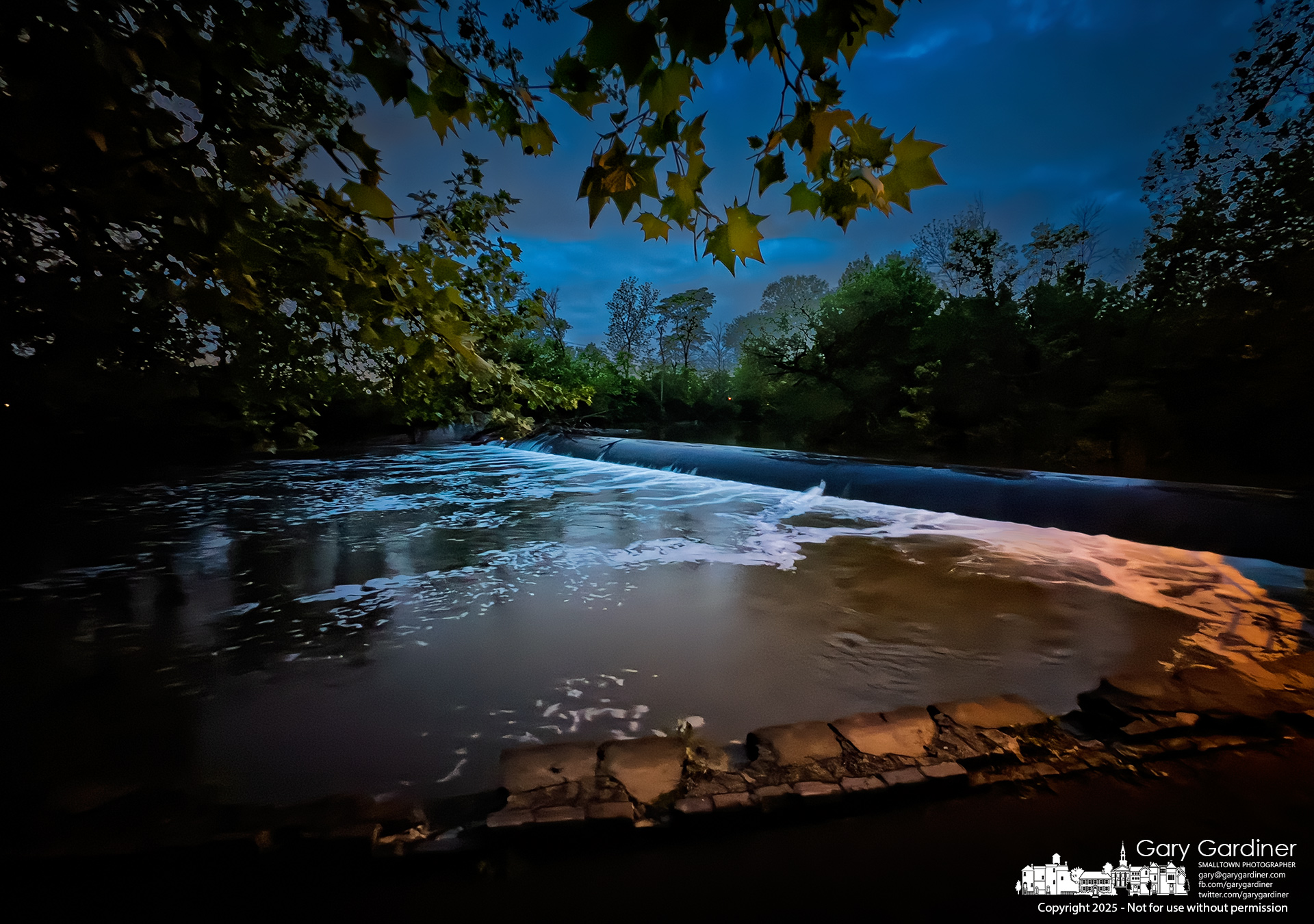 A nighttime rainstorm is moving in from the west, swelling the already high waters rushing over the dam at Alum Creek Park North in Westerville. My Final Photo for May 20, 2025.