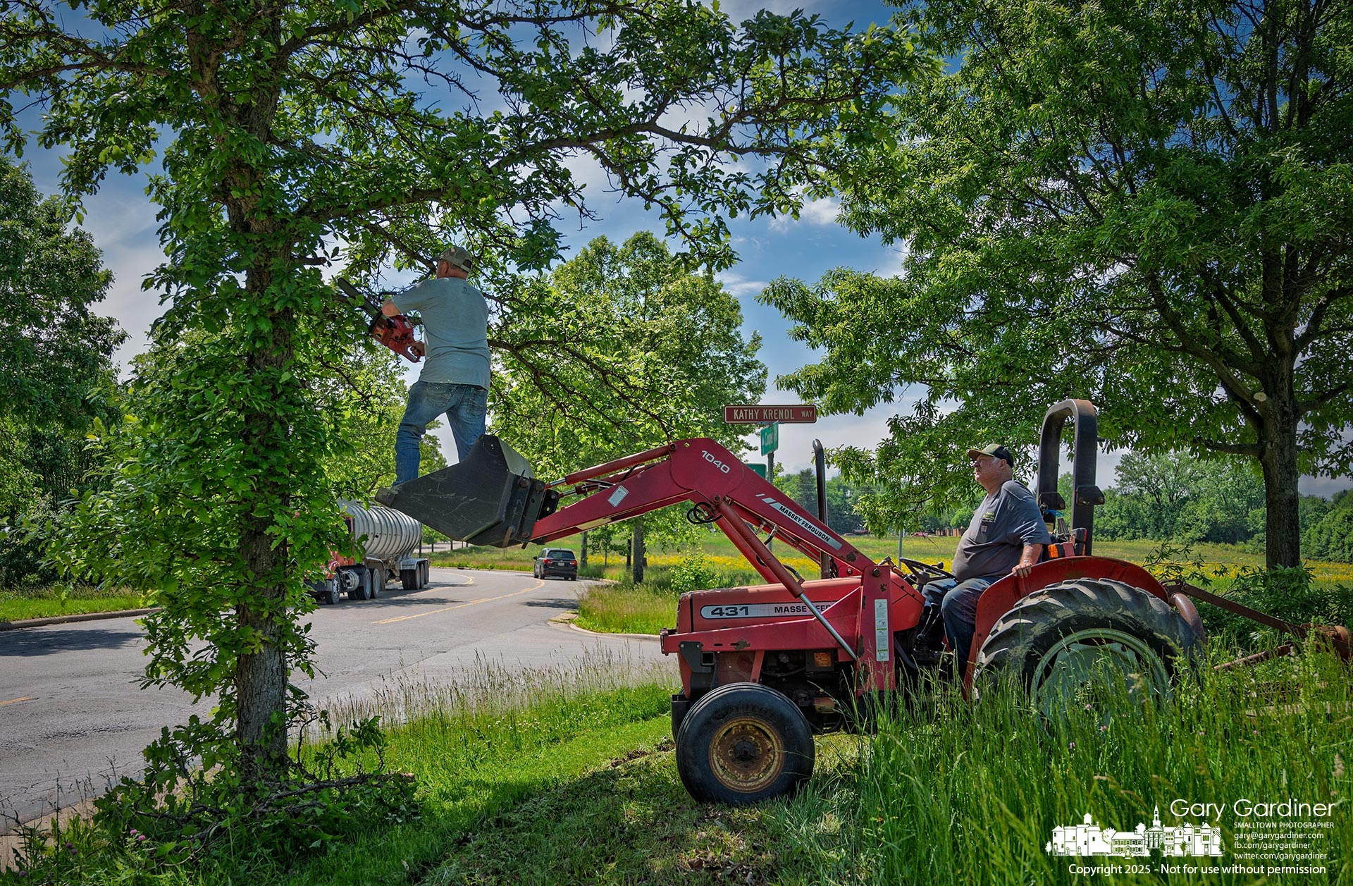 Workers removed low-hanging branches Monday from the Braun Farm and Otterbein farmland along Cooper Road and Collegeview to prevent interference with farm equipment ahead of planting and the hay harvest. My Final Photo for May 19, 2025.