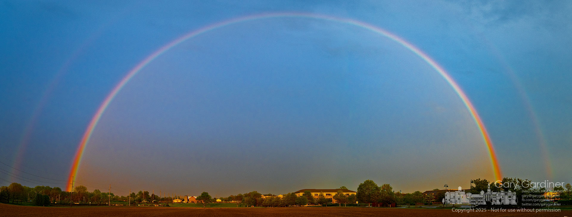 A double rainbow arches over Yarnell Farm’s field after an early evening rainstorm moved east and the setting sun created the optical phenomenon. My Final Photo for May 1, 2025.
