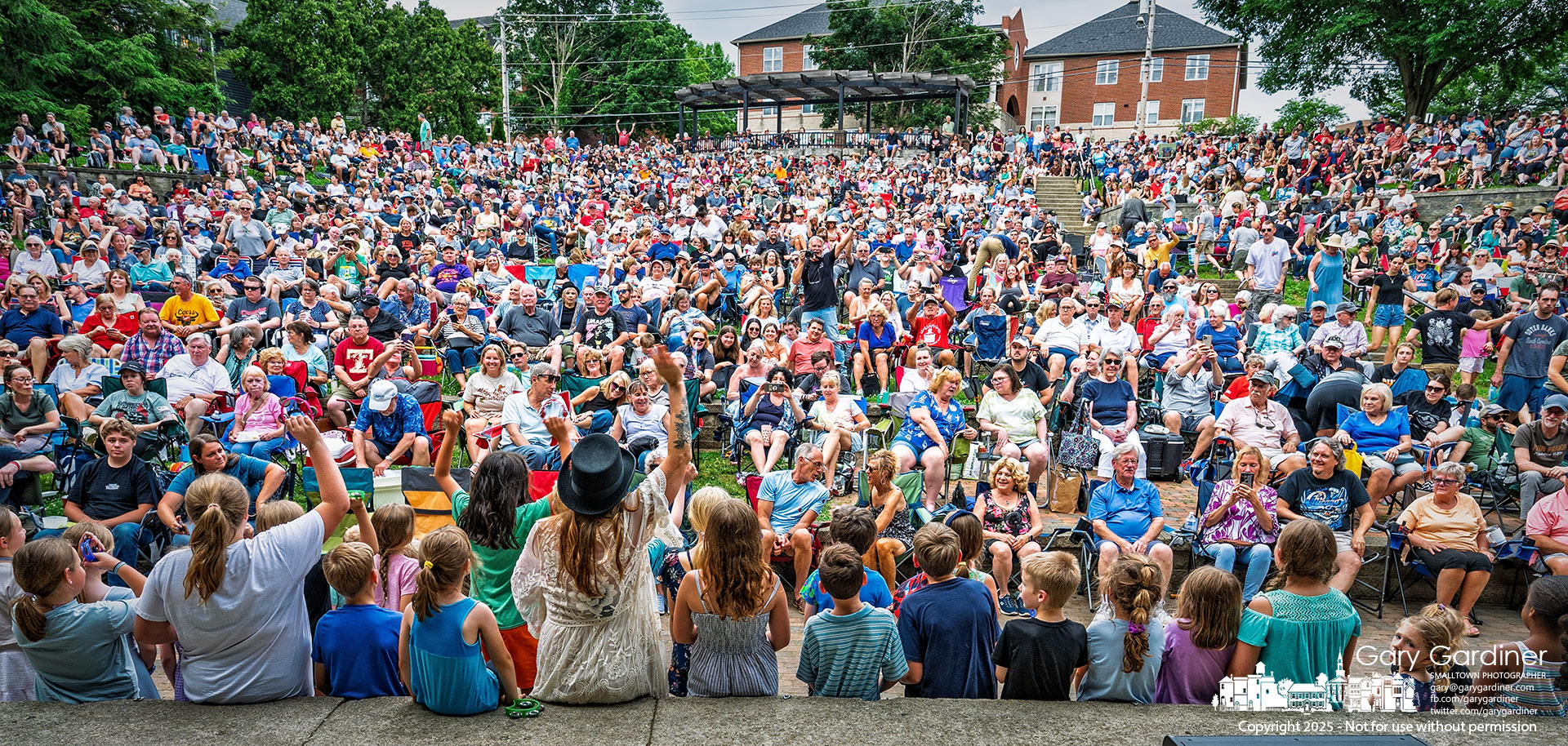 An overflow crowd settled into the seats of the Alum Creek Park Amphitheater, spilling onto the surrounding hills and into the woods around the stage. My Final Photo for June 15, 2025.