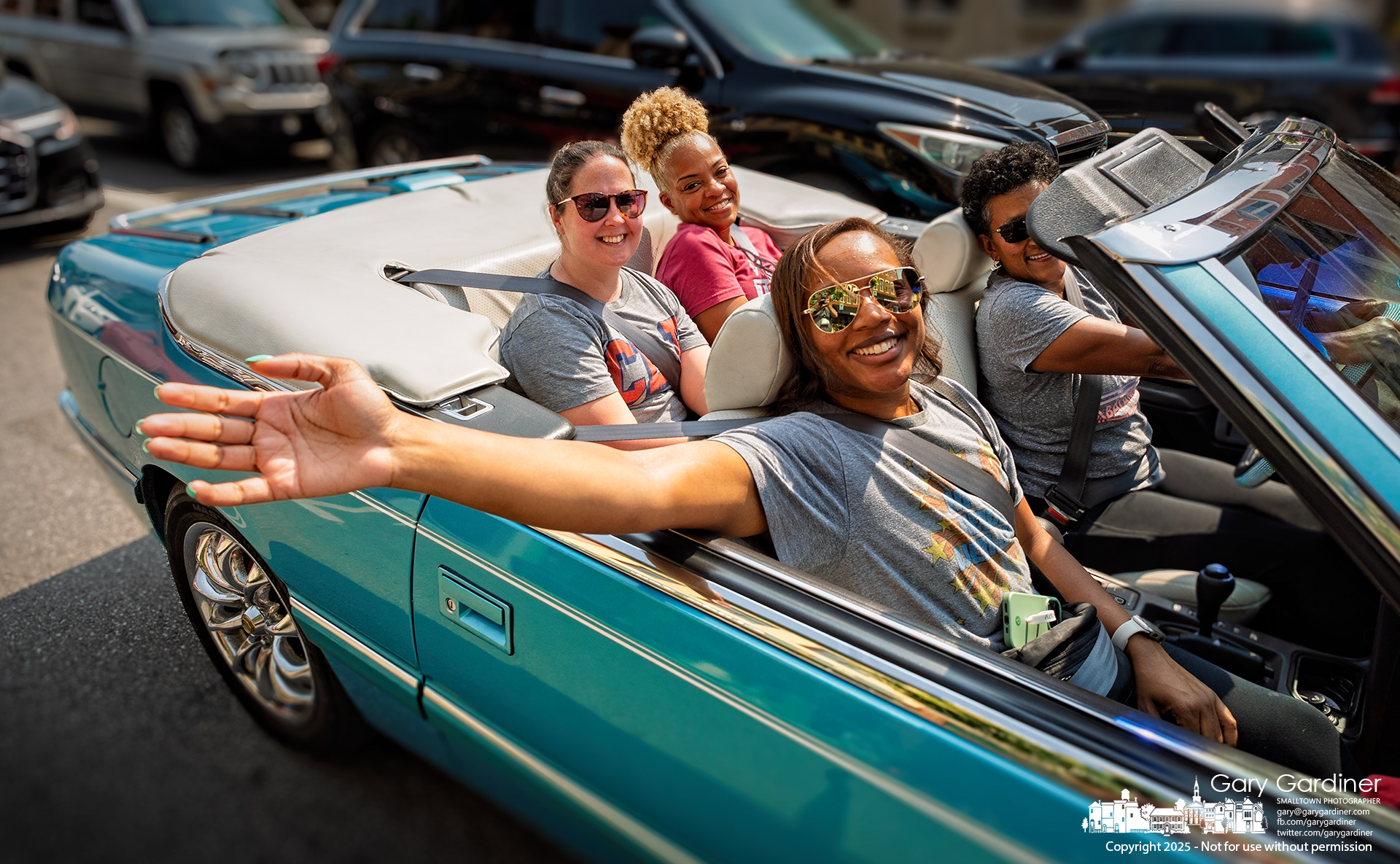 Passengers in a Chrysler LeBaron convertible enjoy a late afternoon cruise through Uptown Westerville on one of the warmest days of the year. My Final Photo for June 3, 2025.