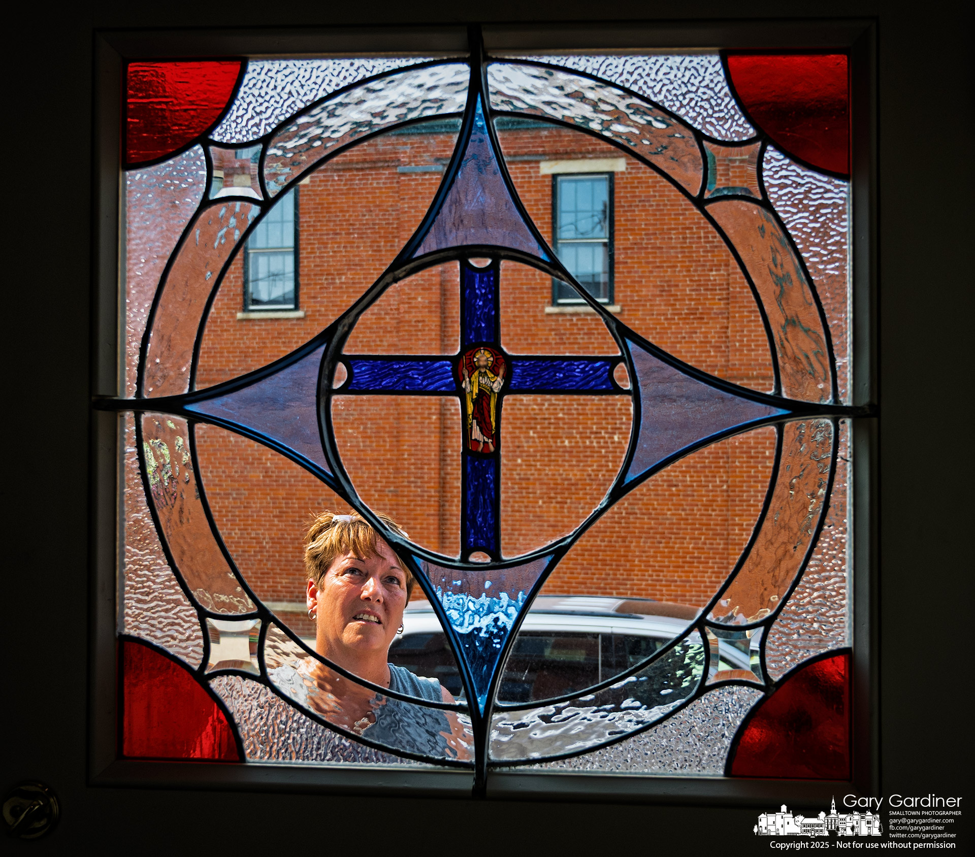 The restored doorway and stained-glass windows at the Holmes Hotel received a final inspection after the restoration work was completed Thursday. My Final Photo for June 12, 2025.