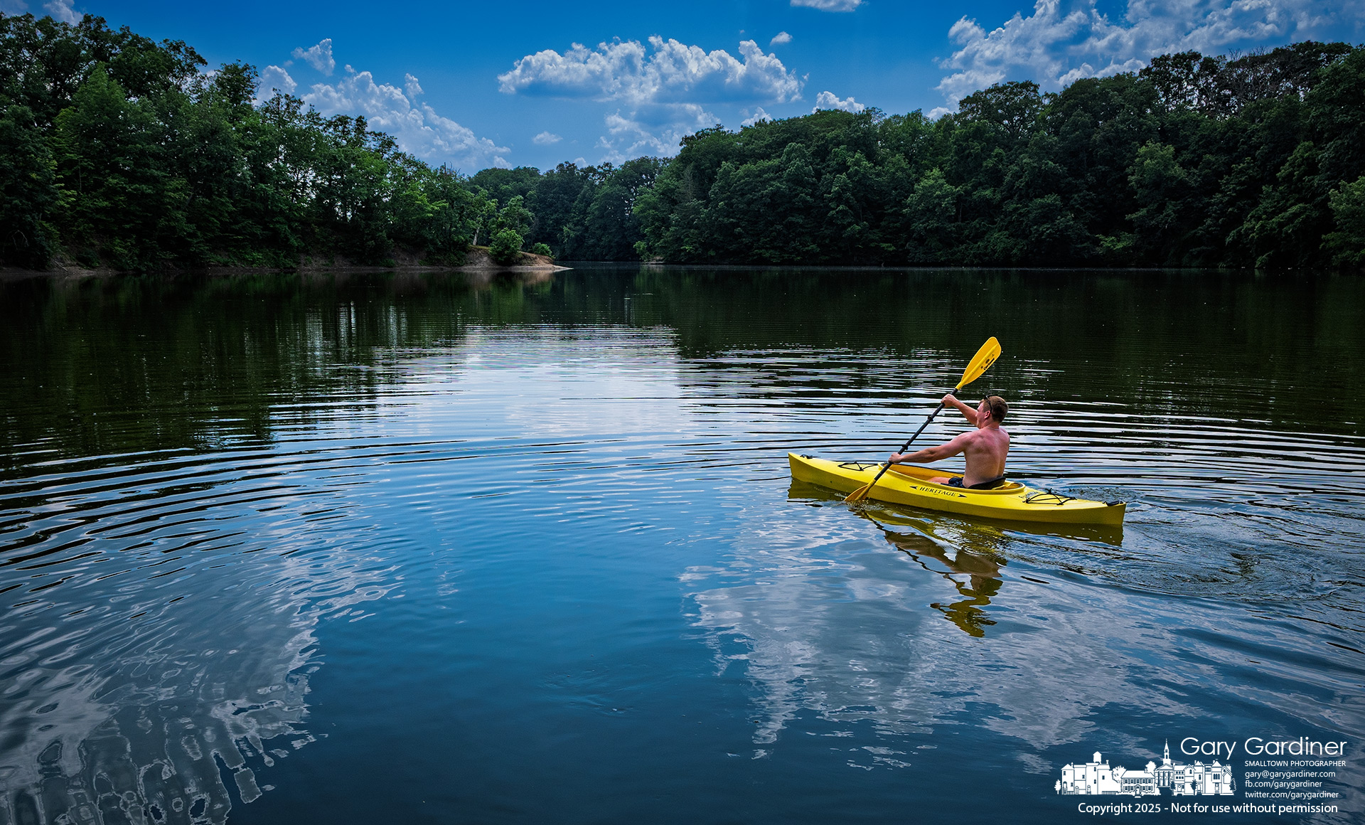 A kayaker paddles into the waters of Hoover Reservoir from the Twin Bridges boat launch, seeking refuge in the nearly still waters of the lake on a very warm summer day. My Final Photo for June 24, 2025.