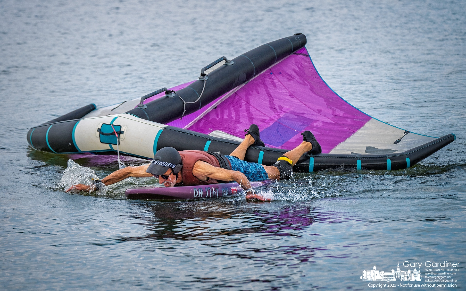 A foil sailor paddles back to shore on Hoover Reservoir after the wind died Thursday afternoon. My Final Photo for July 24, 2025.