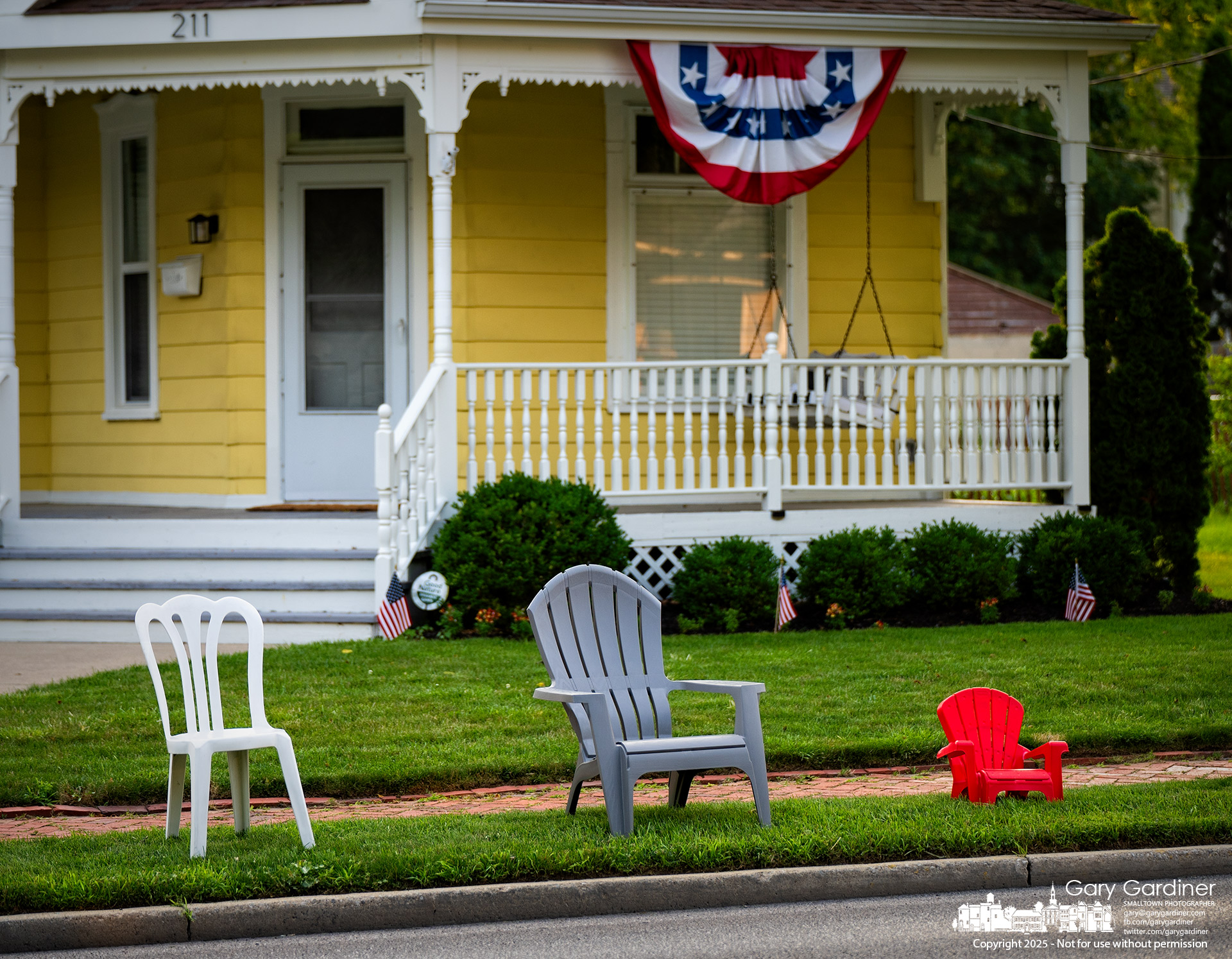 A family's chairs sit curbside Thursday evening to reserve the best spots for Friday’s July 4th parade in Westerville. My Final Photo for July 3, 2025.