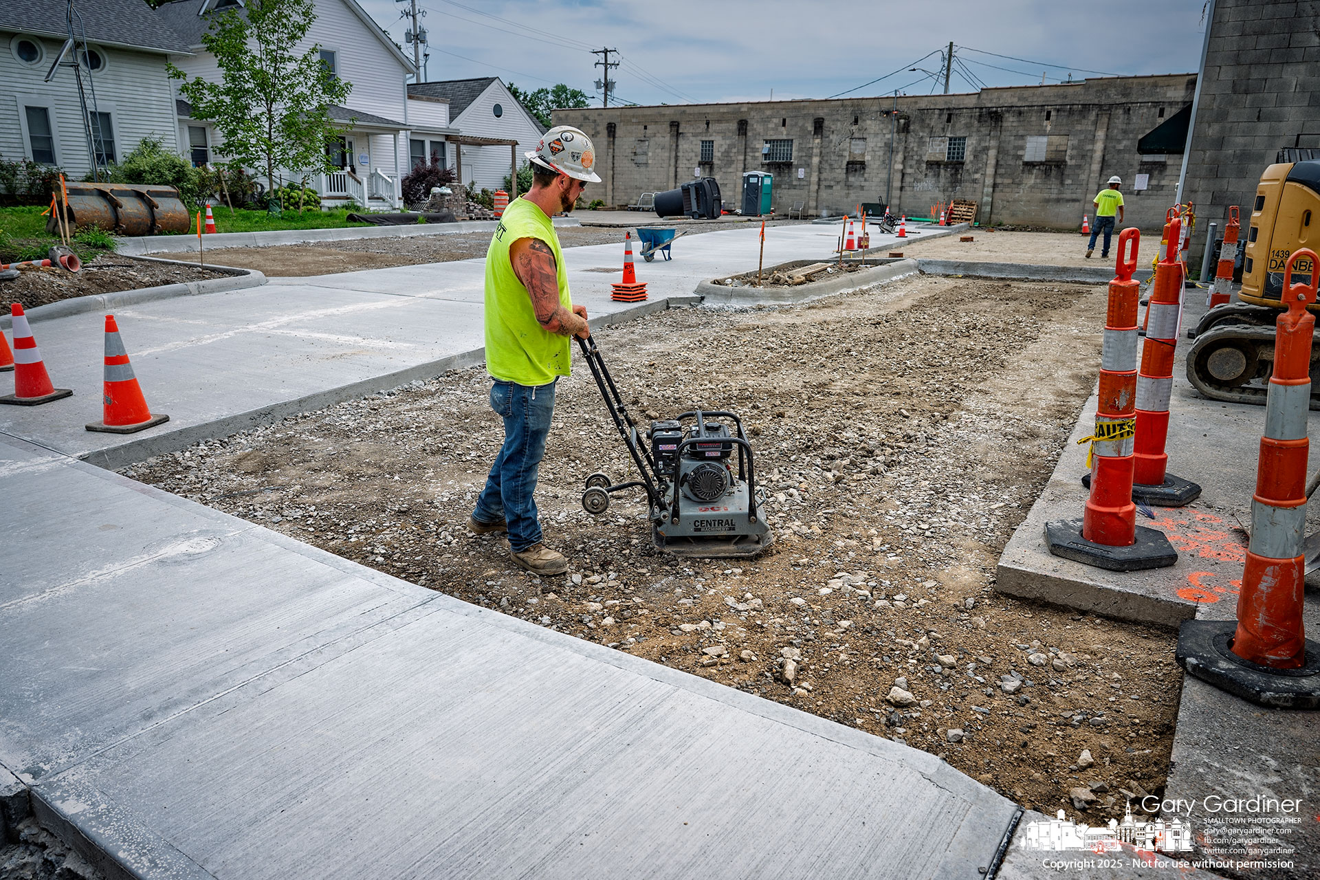 A construction worker levels and compacts the ground in Hanby Alley on Monday as crews prepare to lay asphalt beginning Tuesday. My Final Photo for July 21, 2025.
