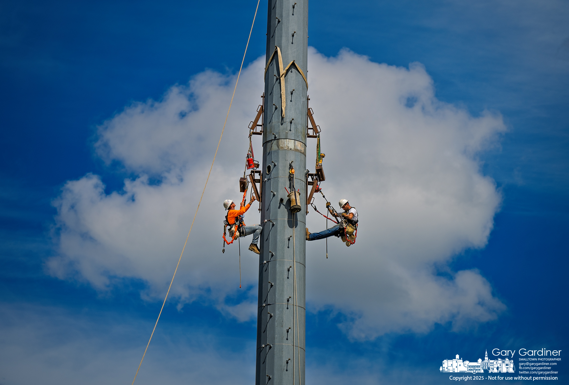 Technicians use bottle jacks to lift a section of a cell tower during its removal at I-270 and 3C Highway. My Final Photo for August 29, 2025