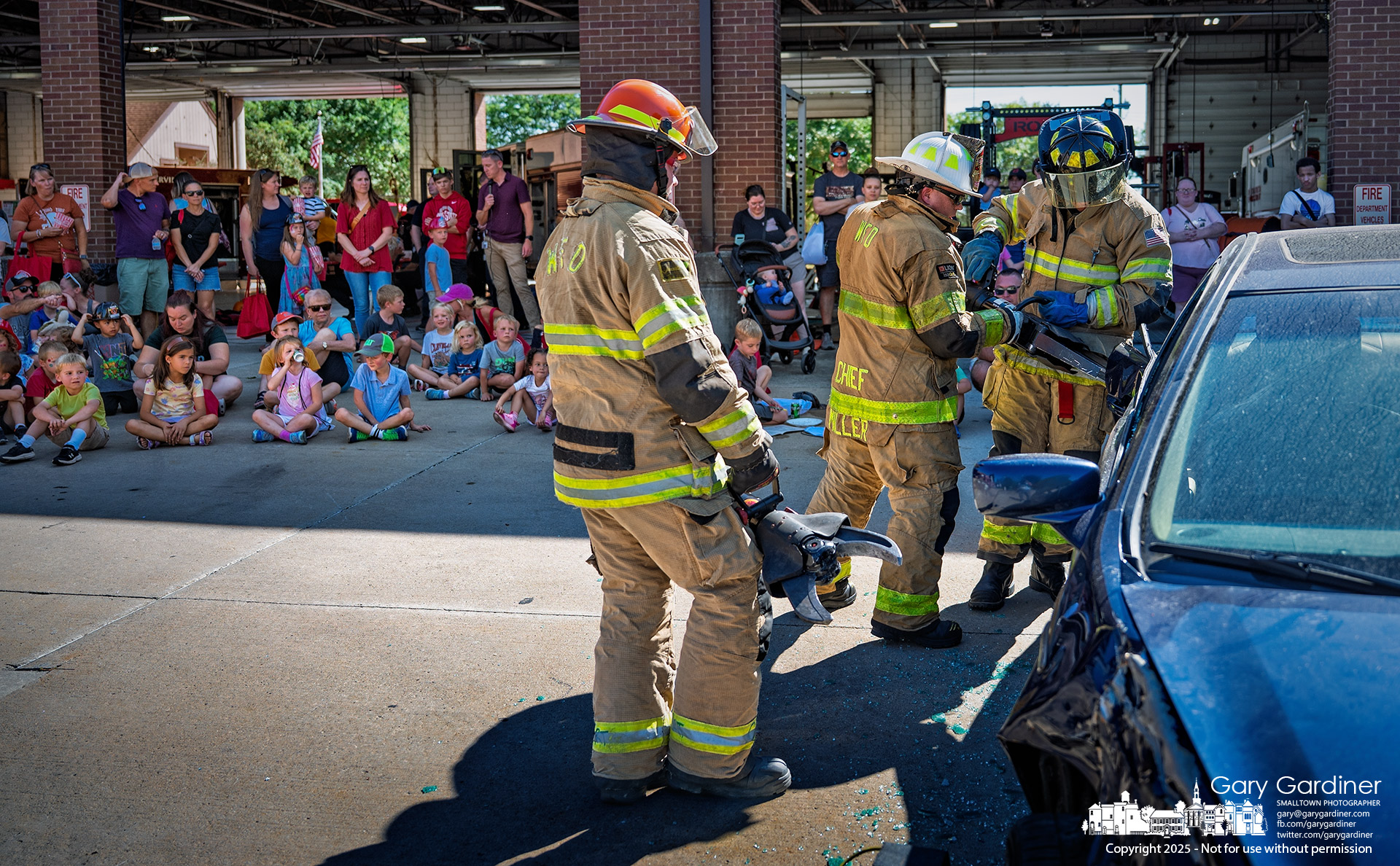 Westerville Fire Chief Brian Miller (center) instructs two fire cadets during a vehicle extraction demonstration at the Fire Prevention Week Open House on Sunday at the main fire station on West Main Street. My Final Photo for October 5, 2025.