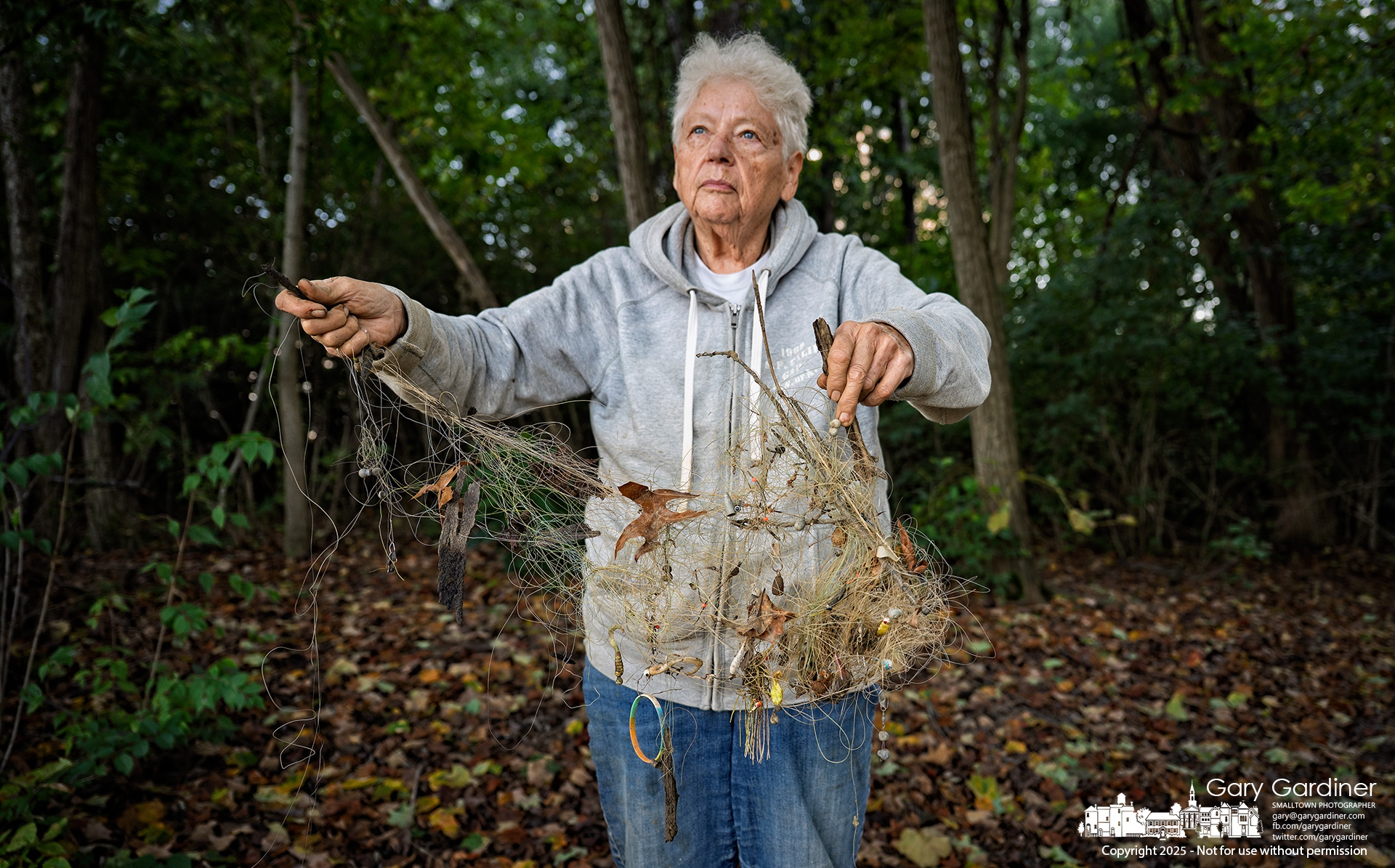 Pat Andrei holds a tangled collection of fishing line and lures she gathered during a walk along a short stretch of the Hoover Reservoir shoreline. My Final Photo for October 8, 2025.